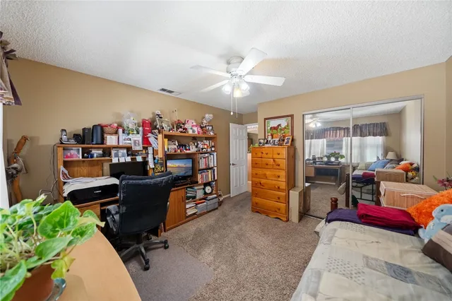 a view of a workspace with furniture and a livingroom