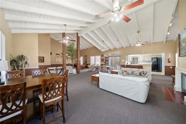 a dining room with furniture and a chandelier