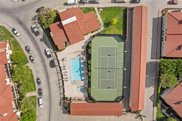 an aerial view of residential houses and outdoor space