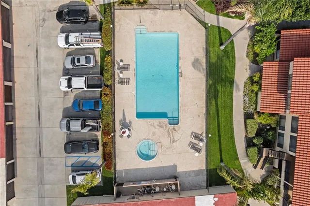 a living room with furniture a fireplace and a chandelier