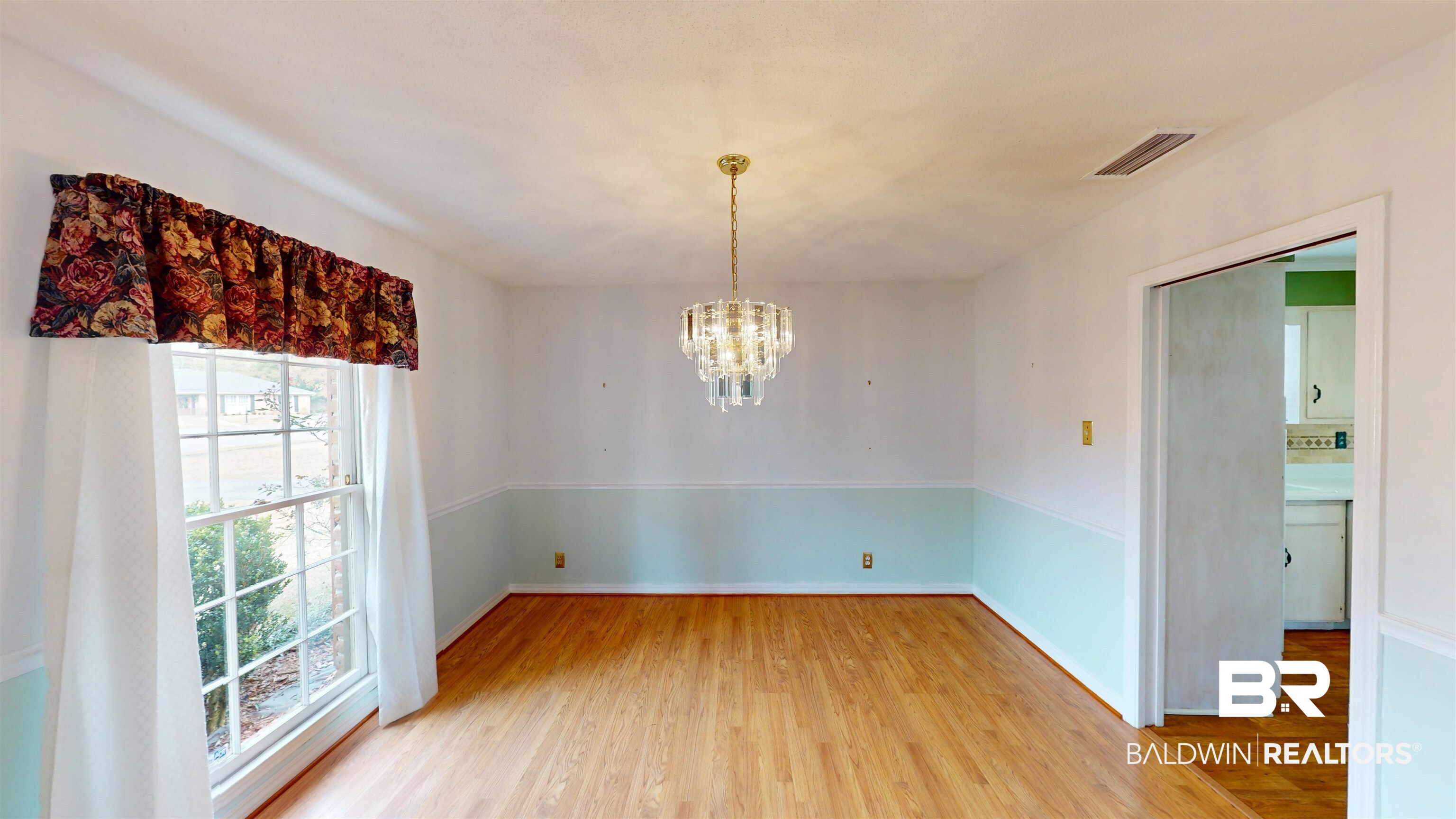 609 Burlington Court Mobile, AL 36608 - Photo 5 of 19 Unfurnished dining area with a chandelier and light wood finished floors