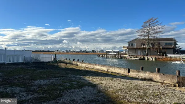 a view of a lake with a big yard