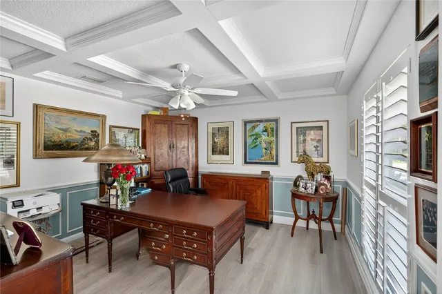 a living room with furniture a flat screen tv and a dining table