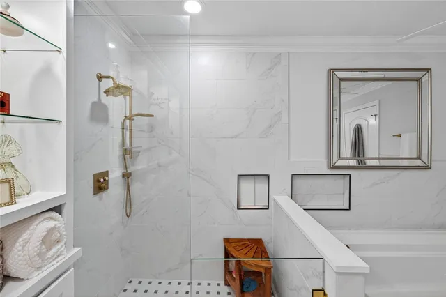 a bathroom with a granite countertop sink a toilet and shower