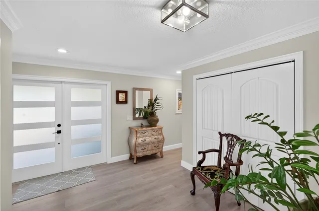 a view of a livingroom with furniture and a chandelier