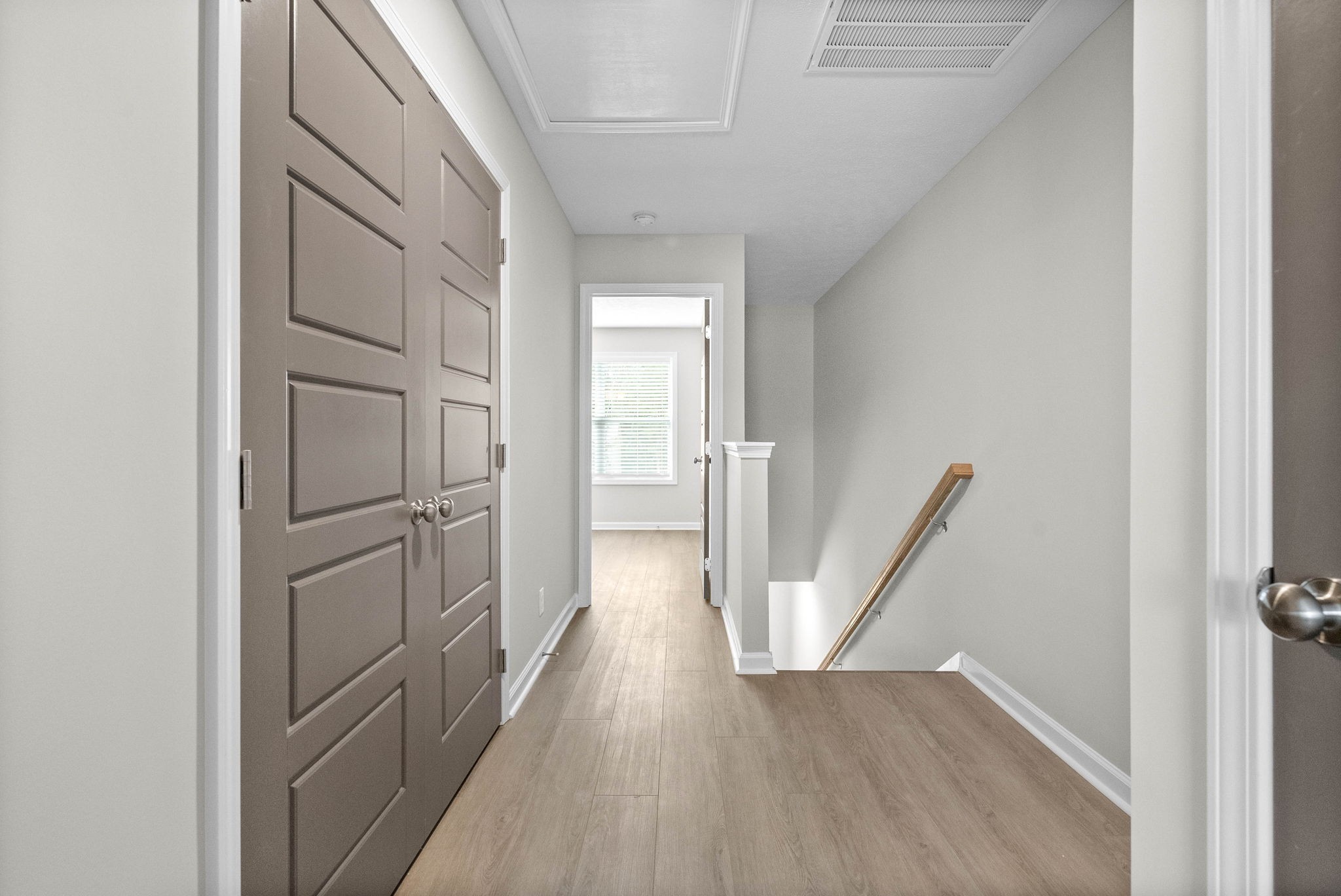 301 Longshadow Trail, Unit B Clarksville, TN 37043 - Photo 12 of 29 a view of a hallway with wooden floor and staircase