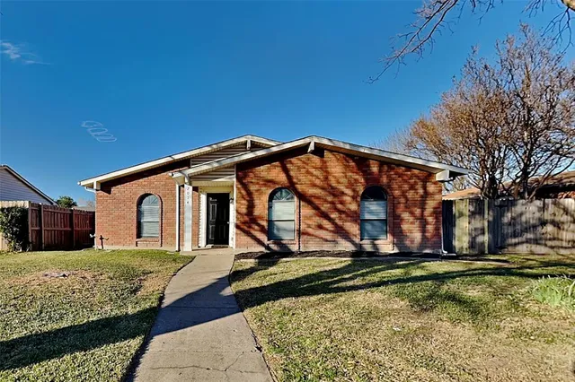 a house with trees in the background