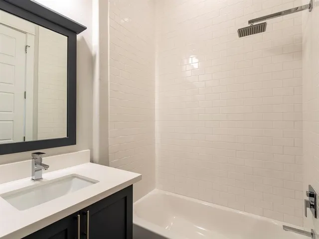 a bathroom with a sink and a bathtub