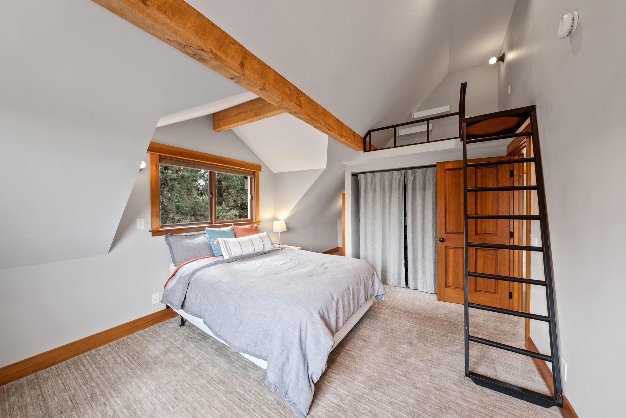65345 Tweed Road Bend, OR 97703 - Photo 46 of 90 a bedroom with a bed and a window