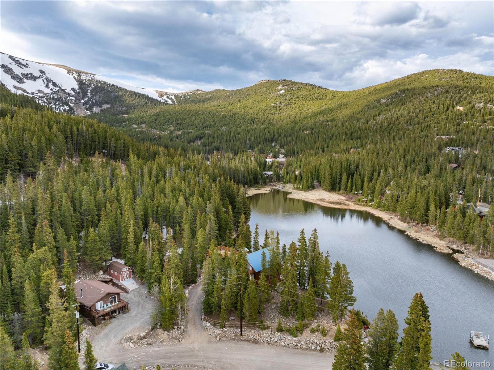 159 Lake Road Idaho Springs, CO 80452 - Photo 1 of 45 a view of a lake with a mountain