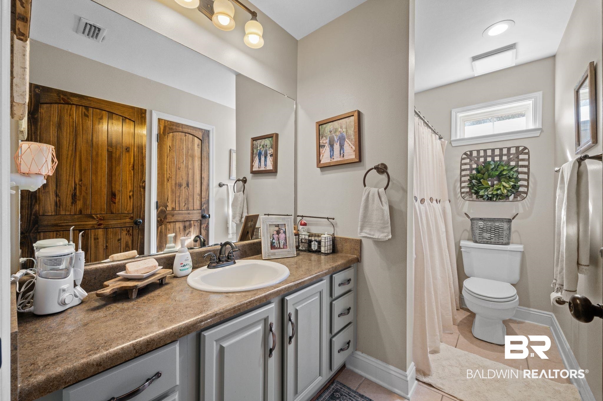 38211-d) V R Byrd Road Bay Minette, AL 36507 - Photo 23 of 58 Bathroom featuring tile patterned flooring, vanity, and toilet