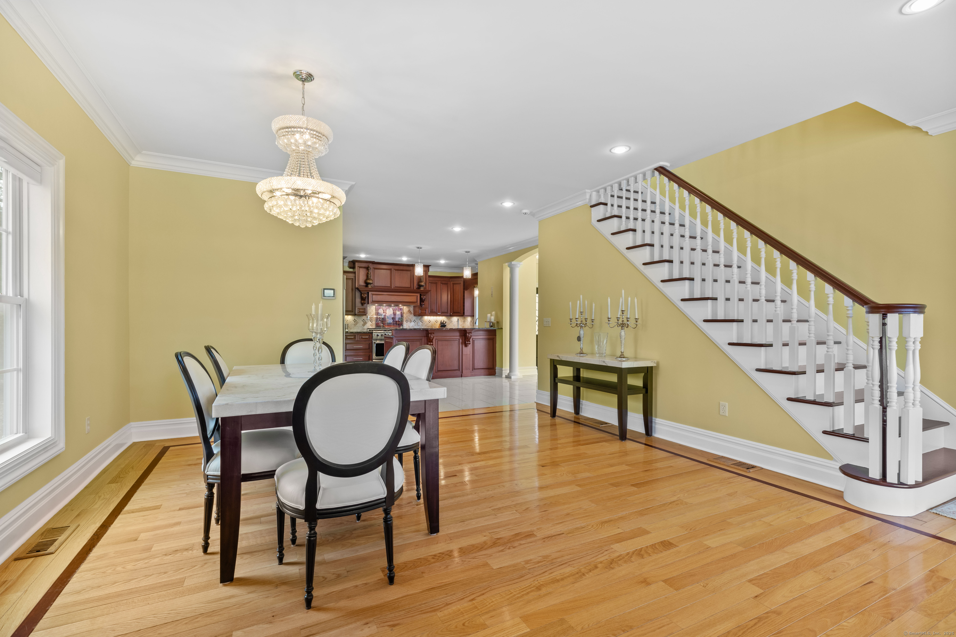 1727 Meriden Road Wolcott, CT 06716 - Photo 11 of 34 a view of a dining room with furniture and wooden floor