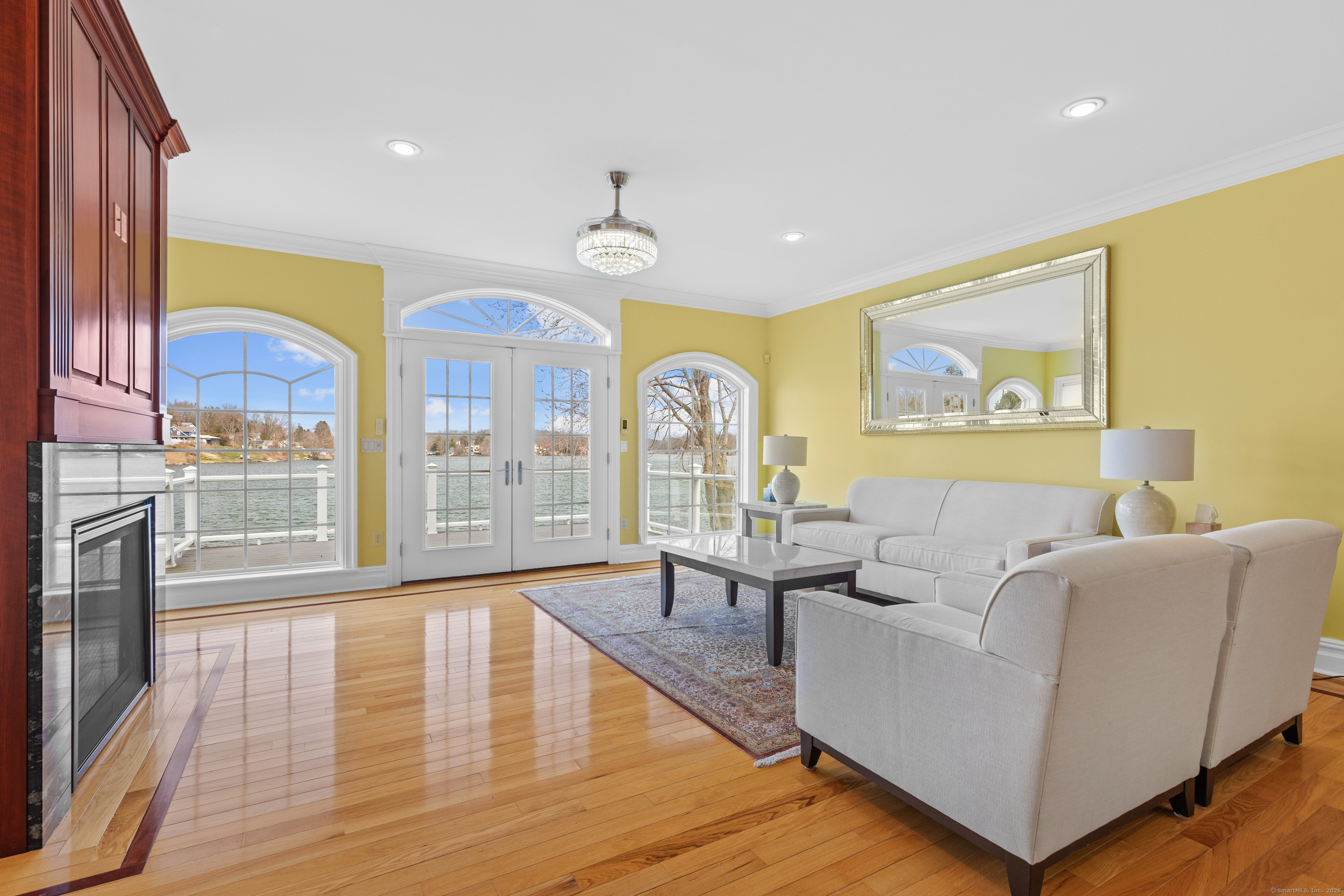 1727 Meriden Road Wolcott, CT 06716 - Photo 12 of 34 a living room with fireplace furniture and a large window