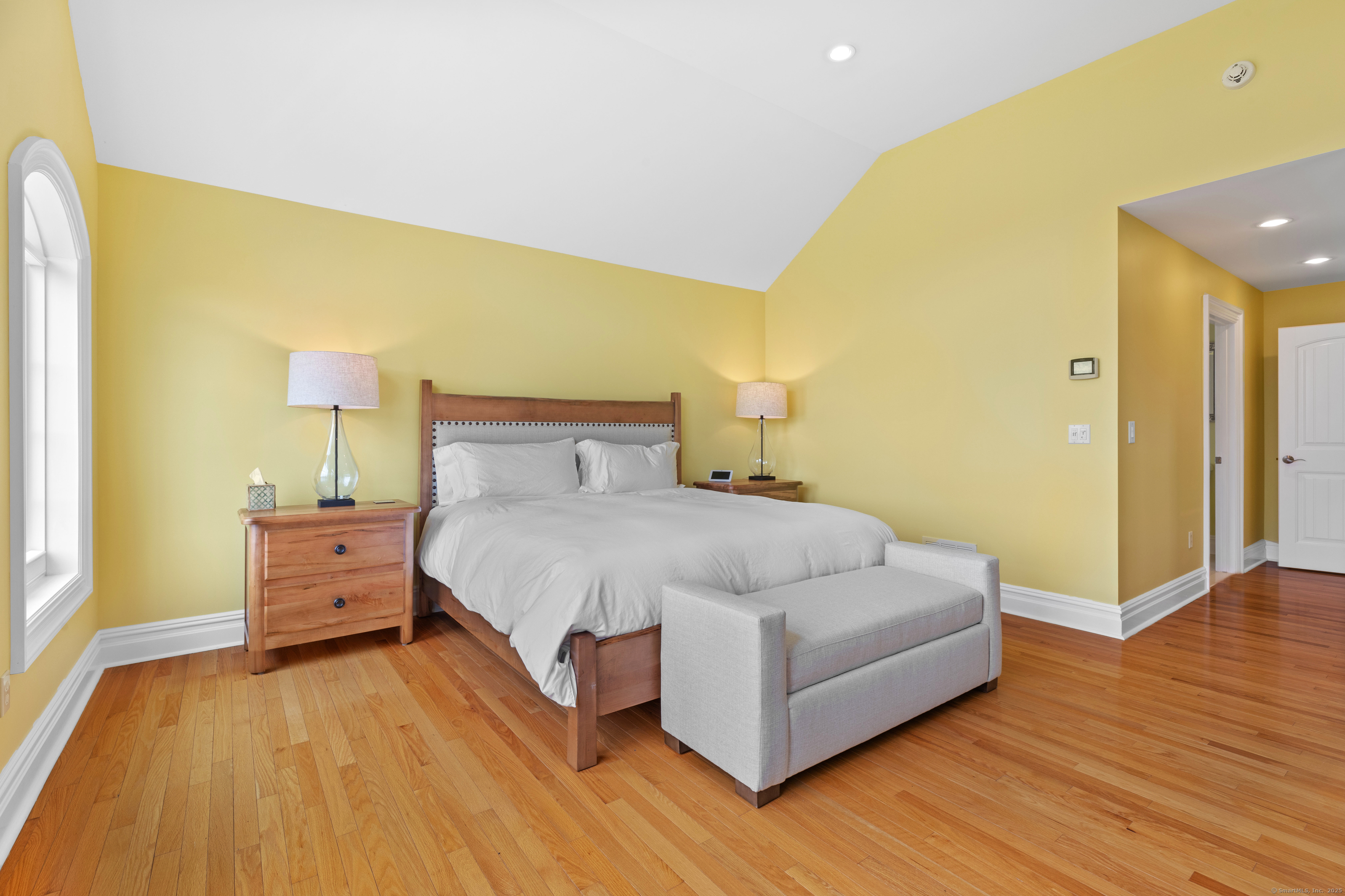 1727 Meriden Road Wolcott, CT 06716 - Photo 16 of 34 a spacious bedroom with a bed and wooden floor