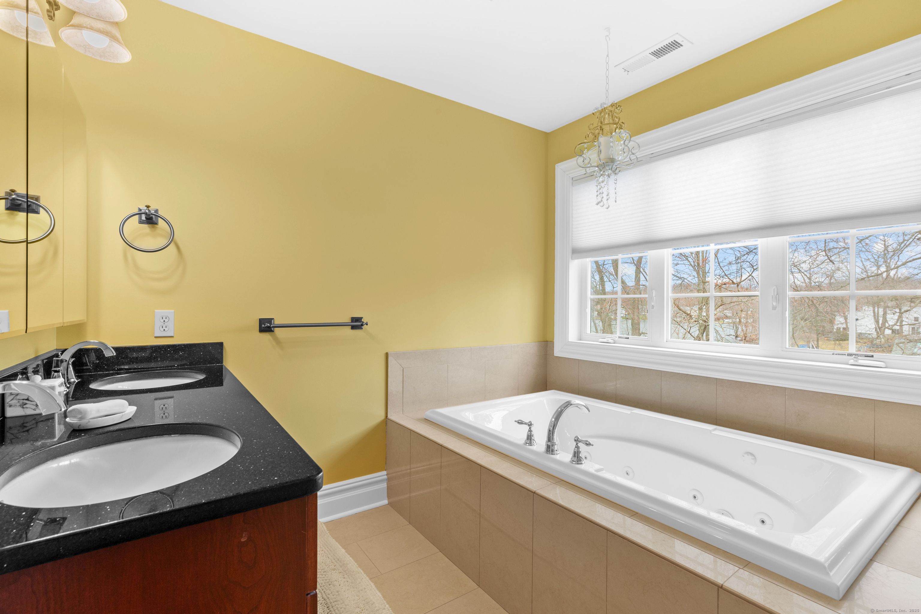 1727 Meriden Road Wolcott, CT 06716 - Photo 17 of 34 a bathroom with a granite countertop sink and a bathtub