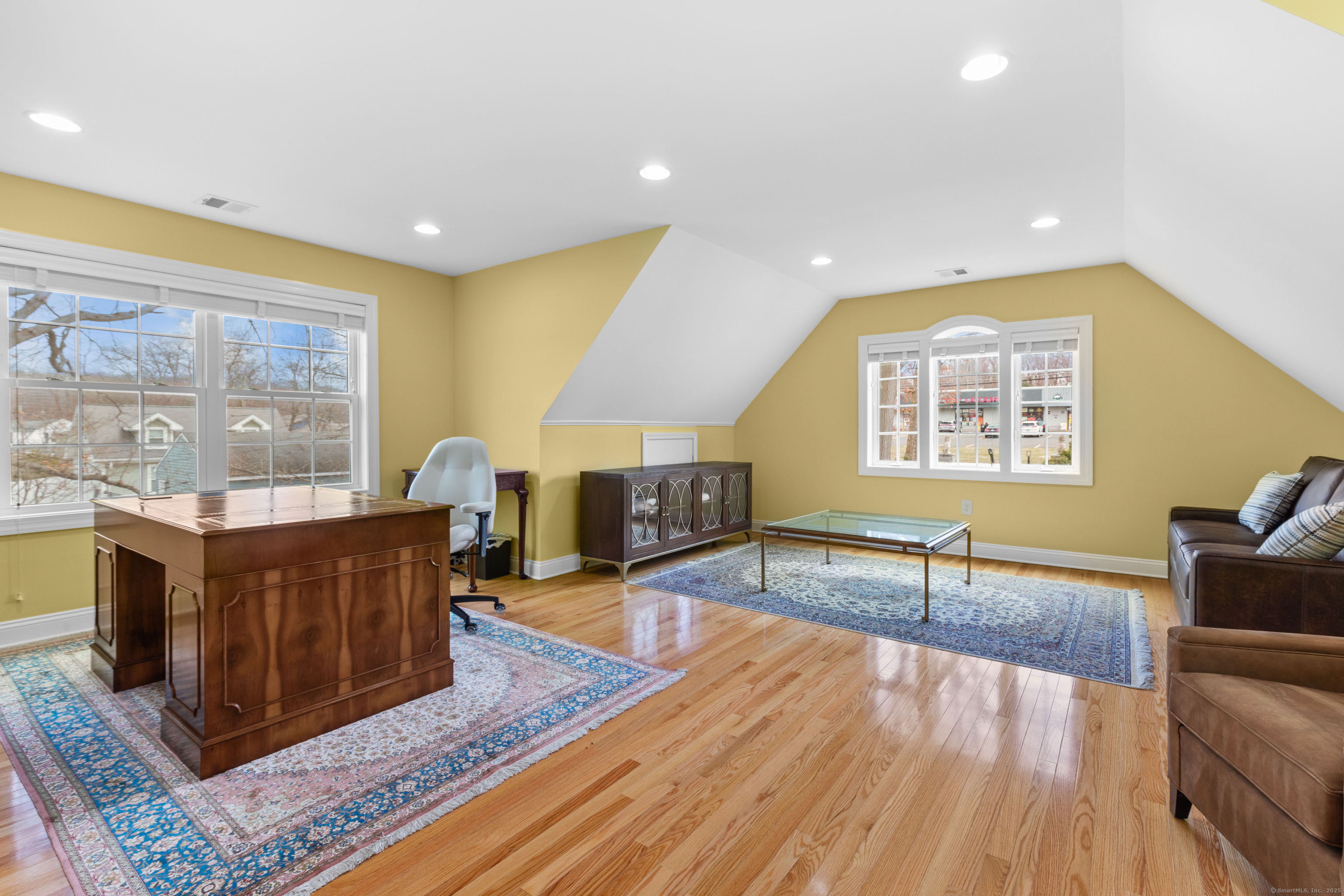 1727 Meriden Road Wolcott, CT 06716 - Photo 20 of 34 a living room with fireplace furniture and a wooden floor
