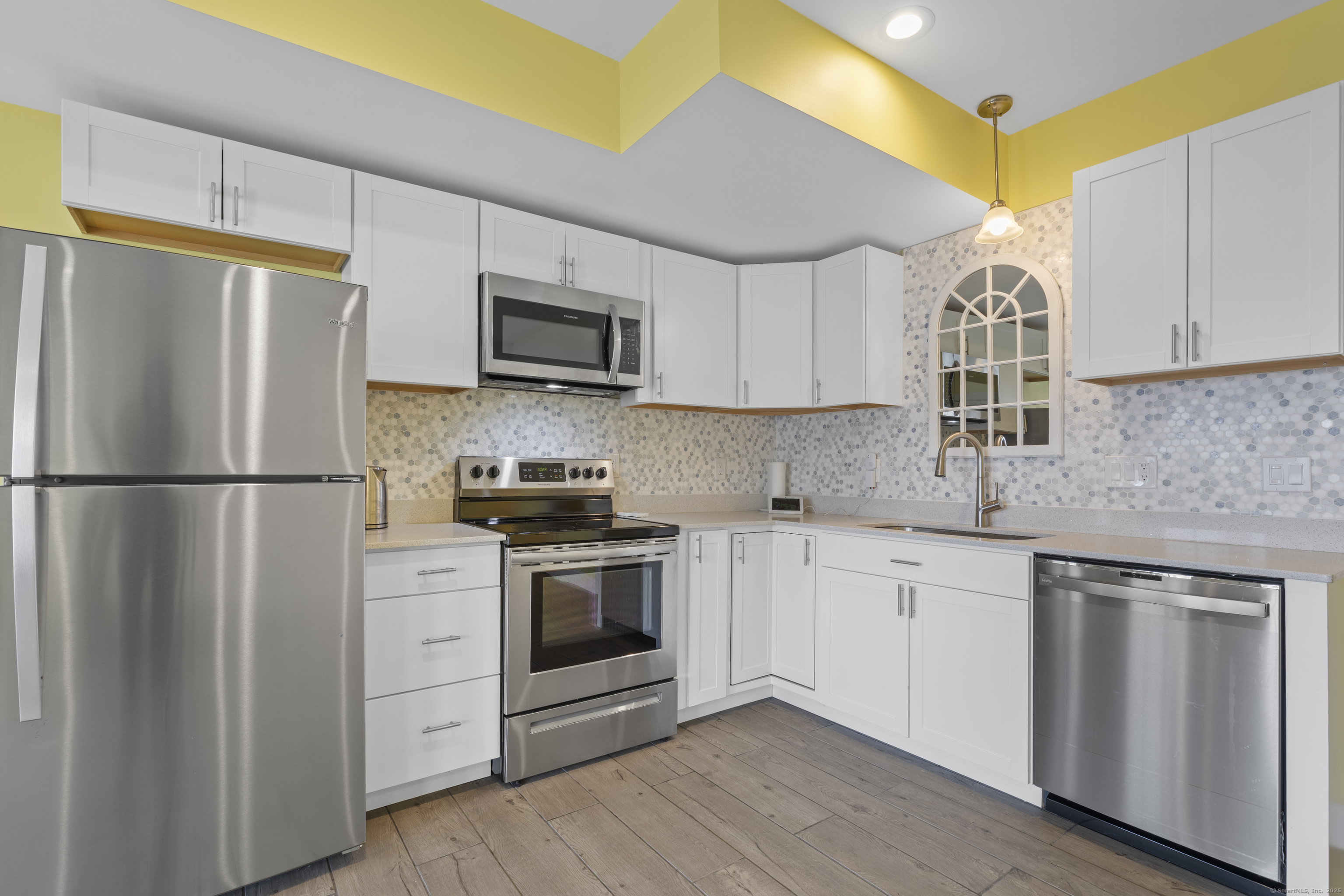 1727 Meriden Road Wolcott, CT 06716 - Photo 23 of 34 a kitchen with stainless steel appliances granite countertop a refrigerator sink and stove