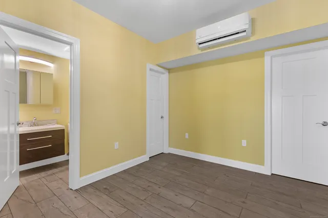 a view of a livingroom with wooden floor