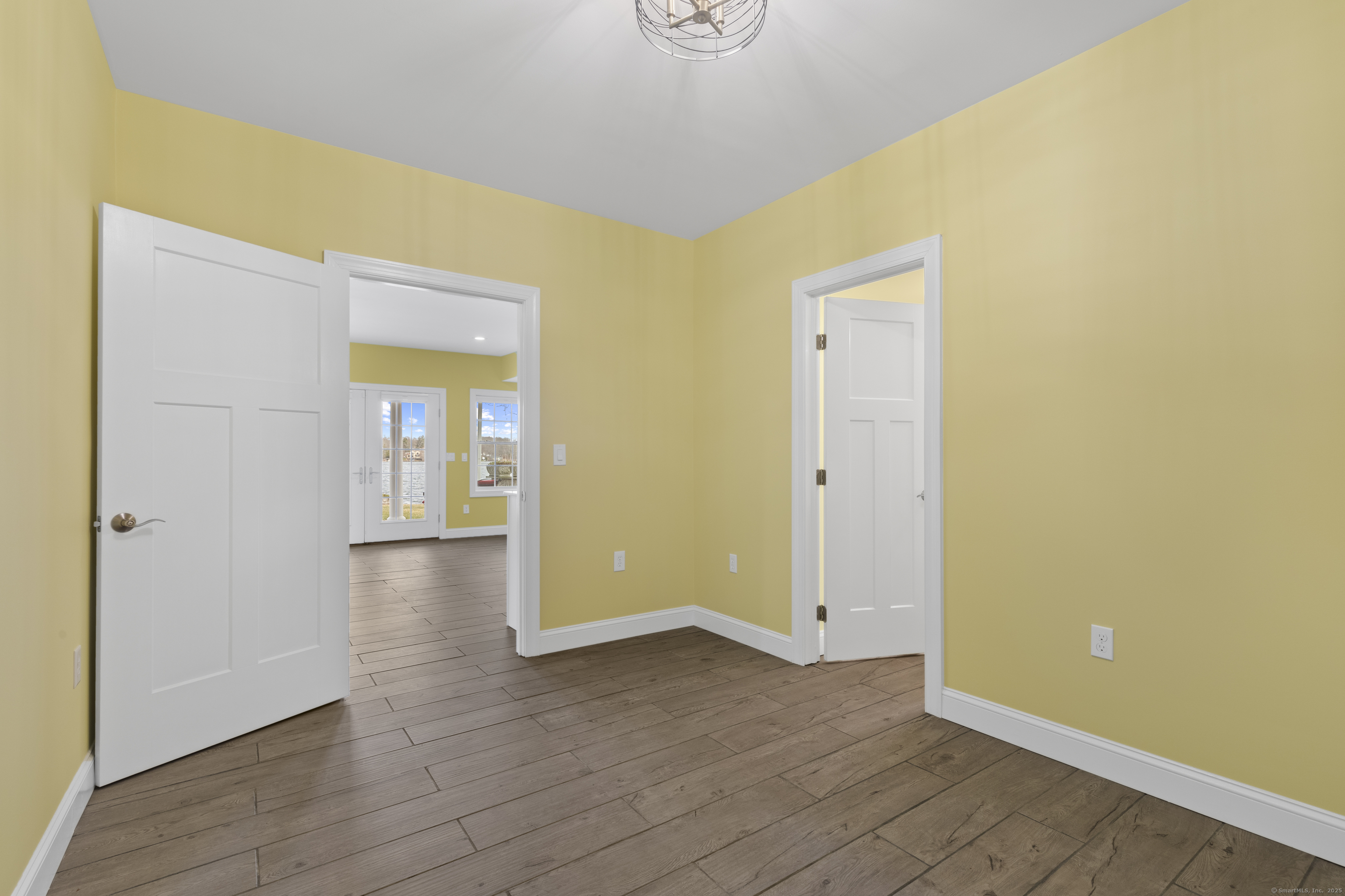 1727 Meriden Road Wolcott, CT 06716 - Photo 26 of 34 a view of an empty room with closet and wooden floor