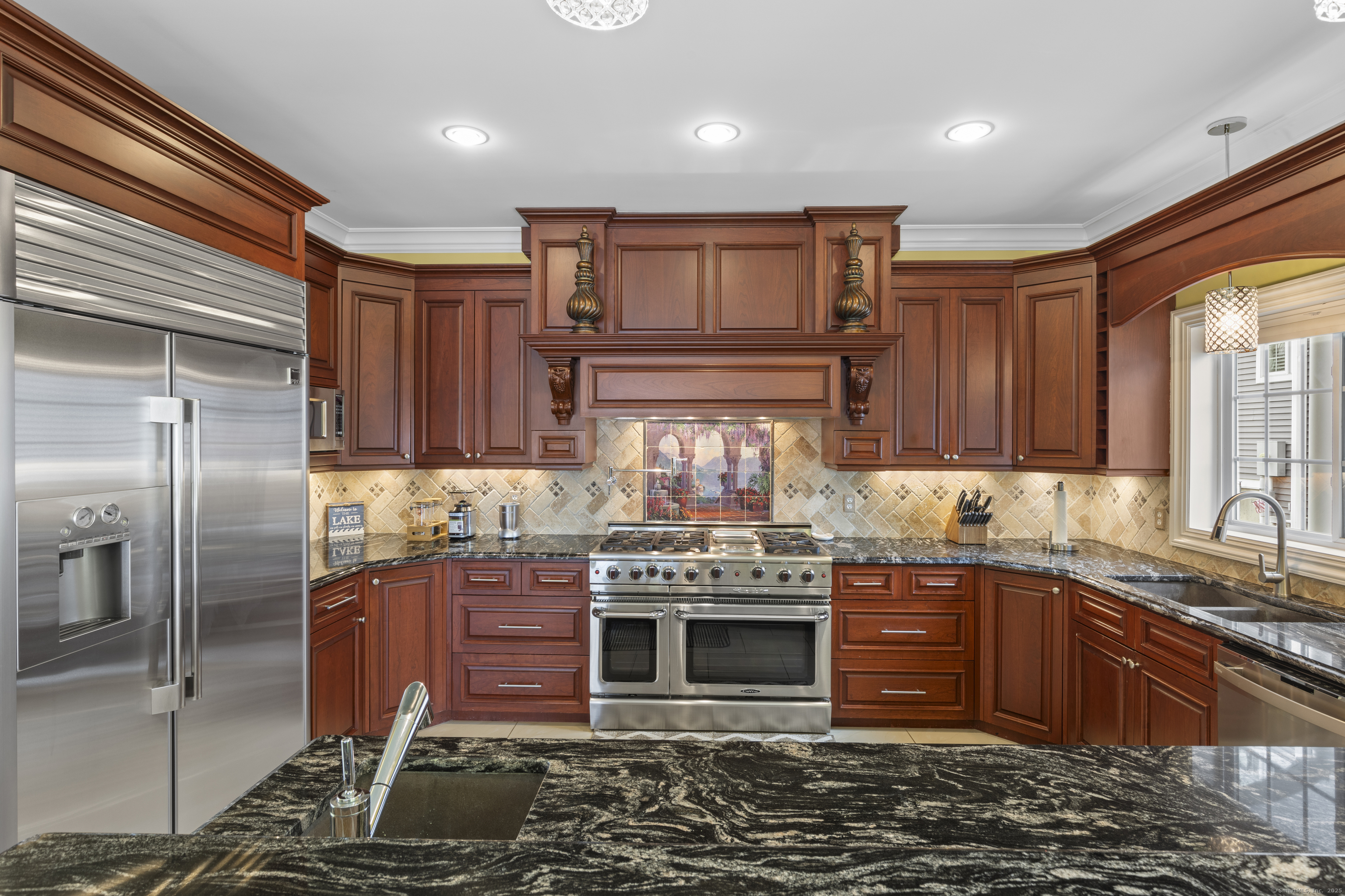1727 Meriden Road Wolcott, CT 06716 - Photo 7 of 34 a kitchen with stainless steel appliances granite countertop a stove a sink and a microwave