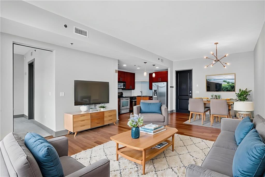 a living room with furniture and a flat screen tv