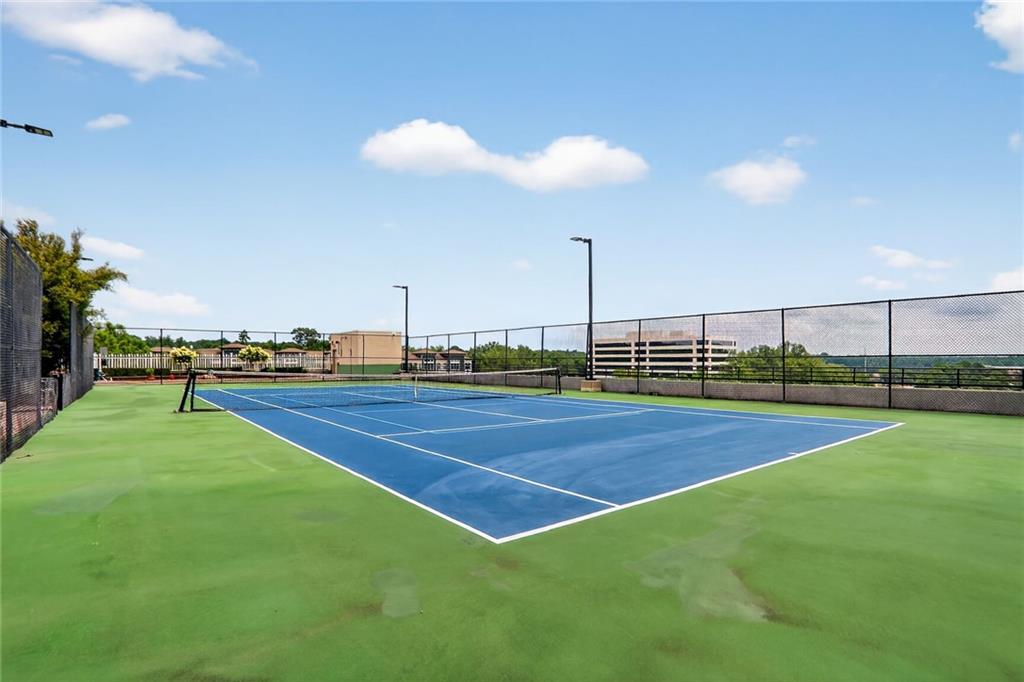 4561 Olde Perimeter Way, Unit 1207 Atlanta, GA 30346 - Photo 21 of 32 a view of a tennis court