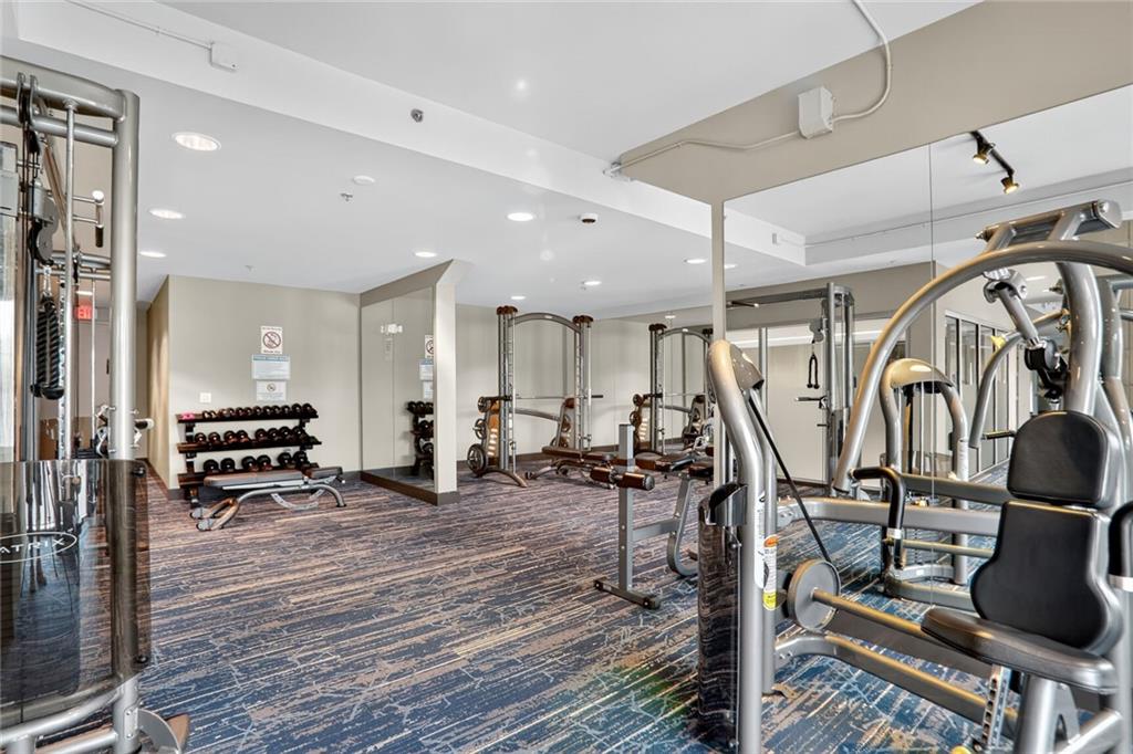 4561 Olde Perimeter Way, Unit 1207 Atlanta, GA 30346 - Photo 24 of 32 a view of a room with gym equipment