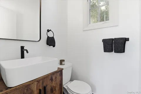 a bed room with a bed and a chair