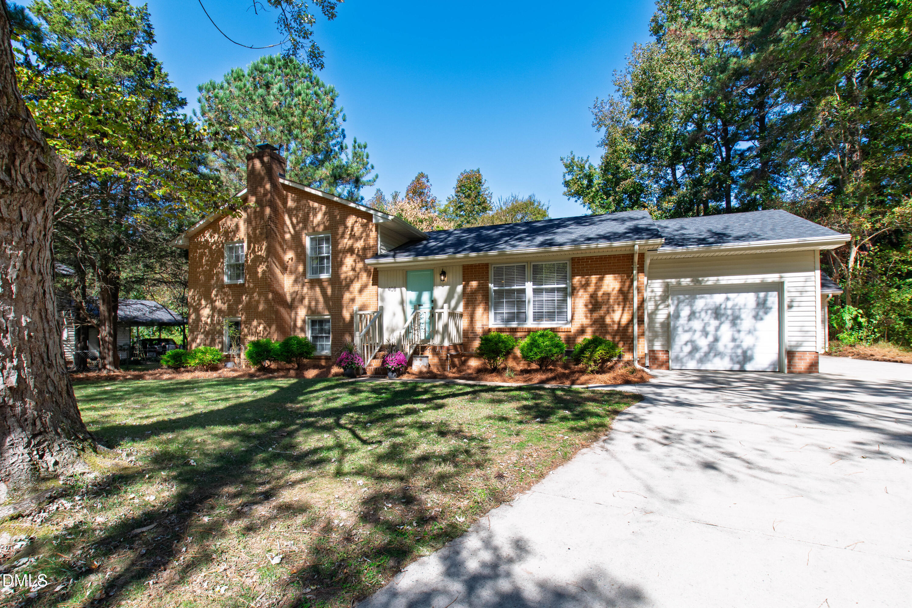 408 Troy Place Raleigh, NC 27609 - Photo 1 of 49 a front view of a house with a yard