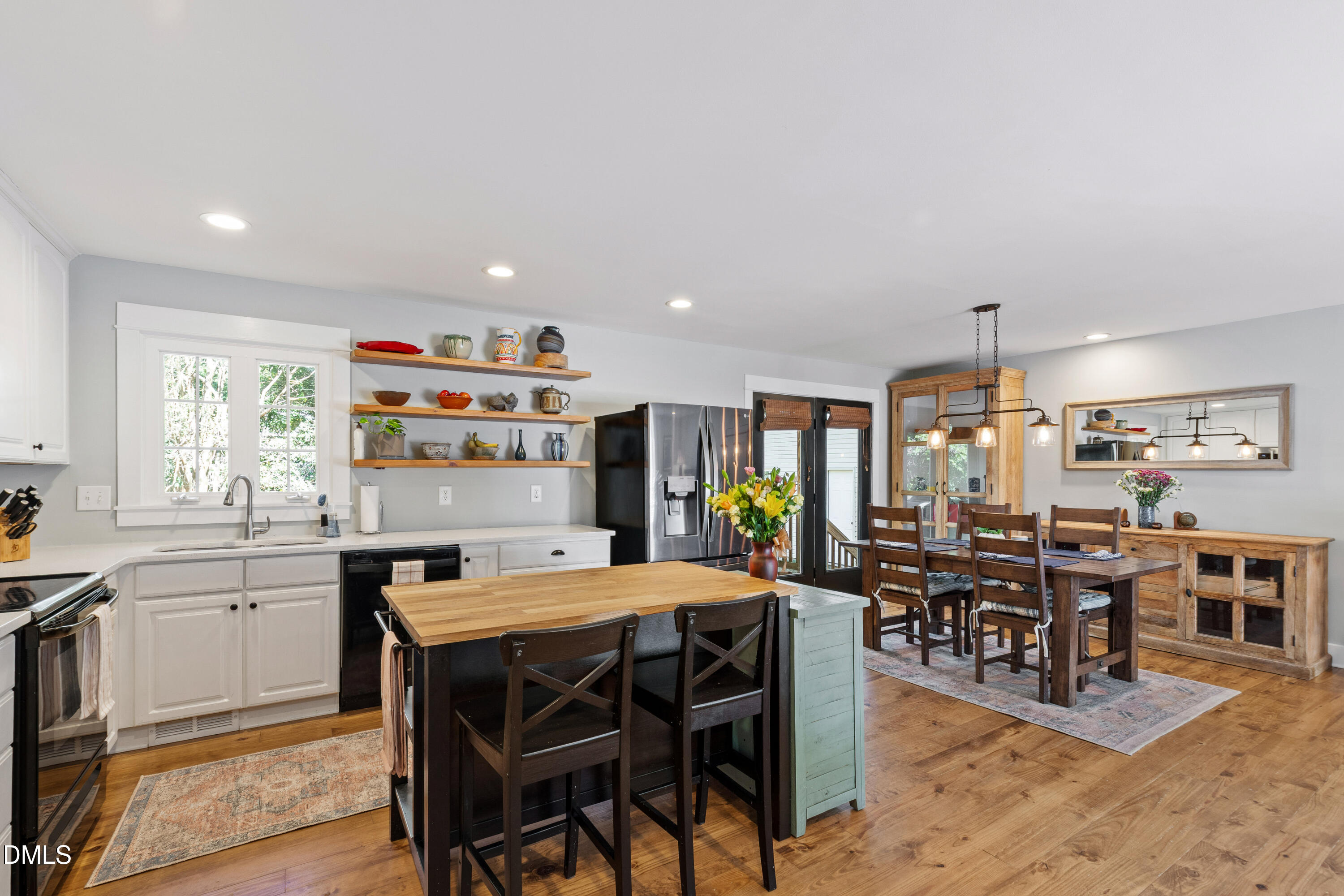 408 Troy Place Raleigh, NC 27609 - Photo 14 of 49 a view of a dining room with furniture and chandelier