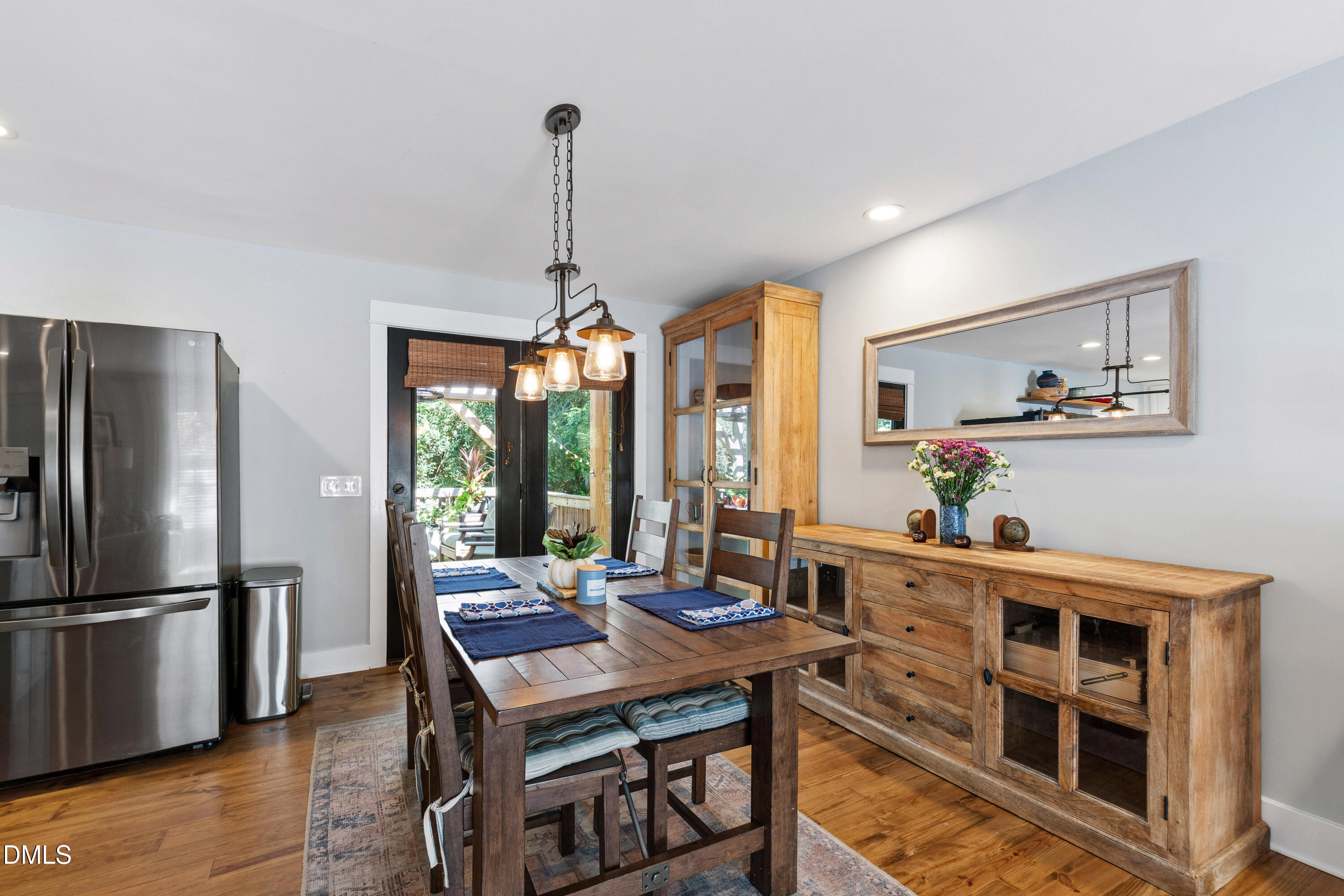 408 Troy Place Raleigh, NC 27609 - Photo 16 of 49 a view of a dining room with furniture window and wooden floor