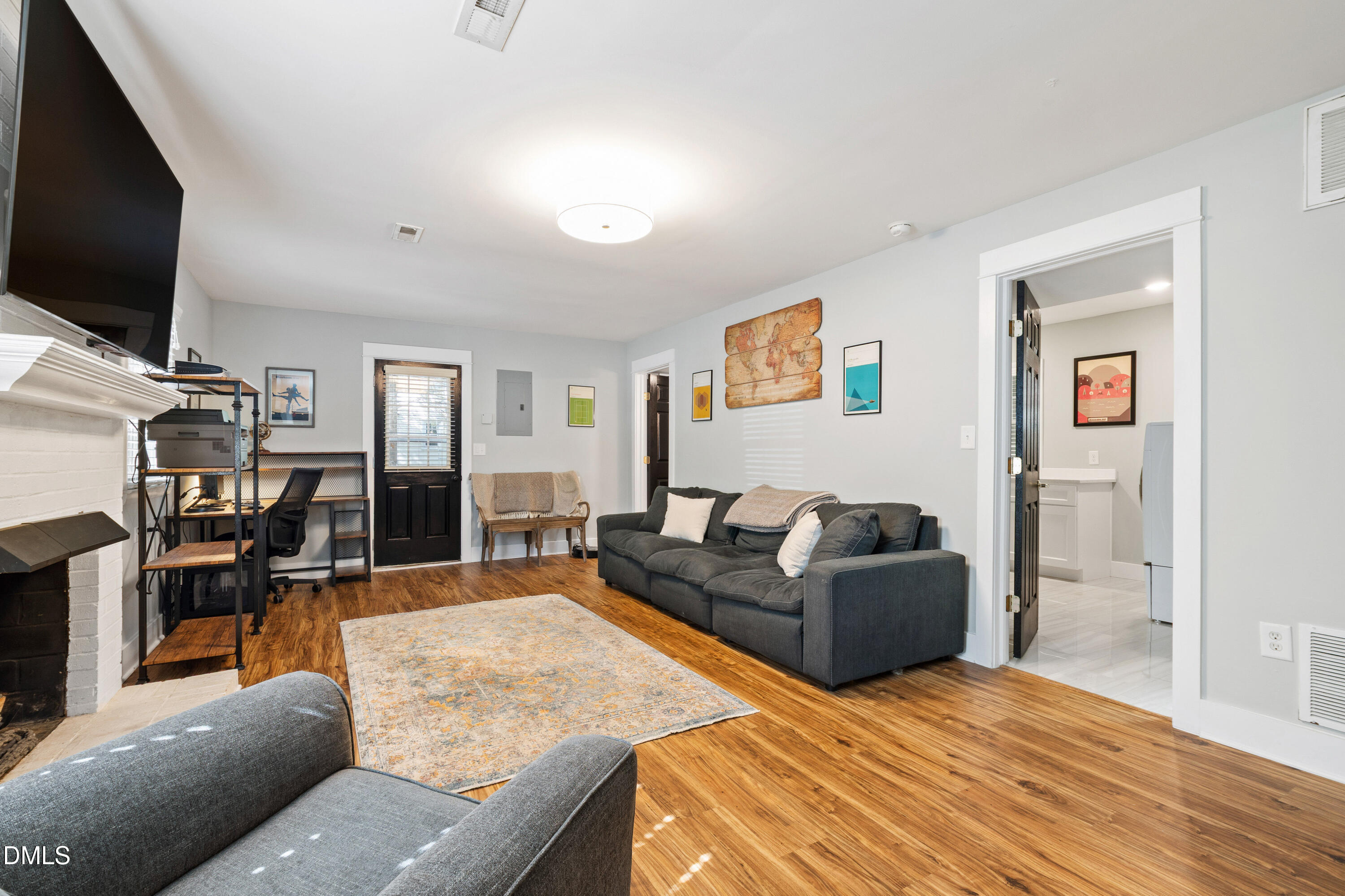 408 Troy Place Raleigh, NC 27609 - Photo 18 of 49 a living room with furniture and a flat screen tv