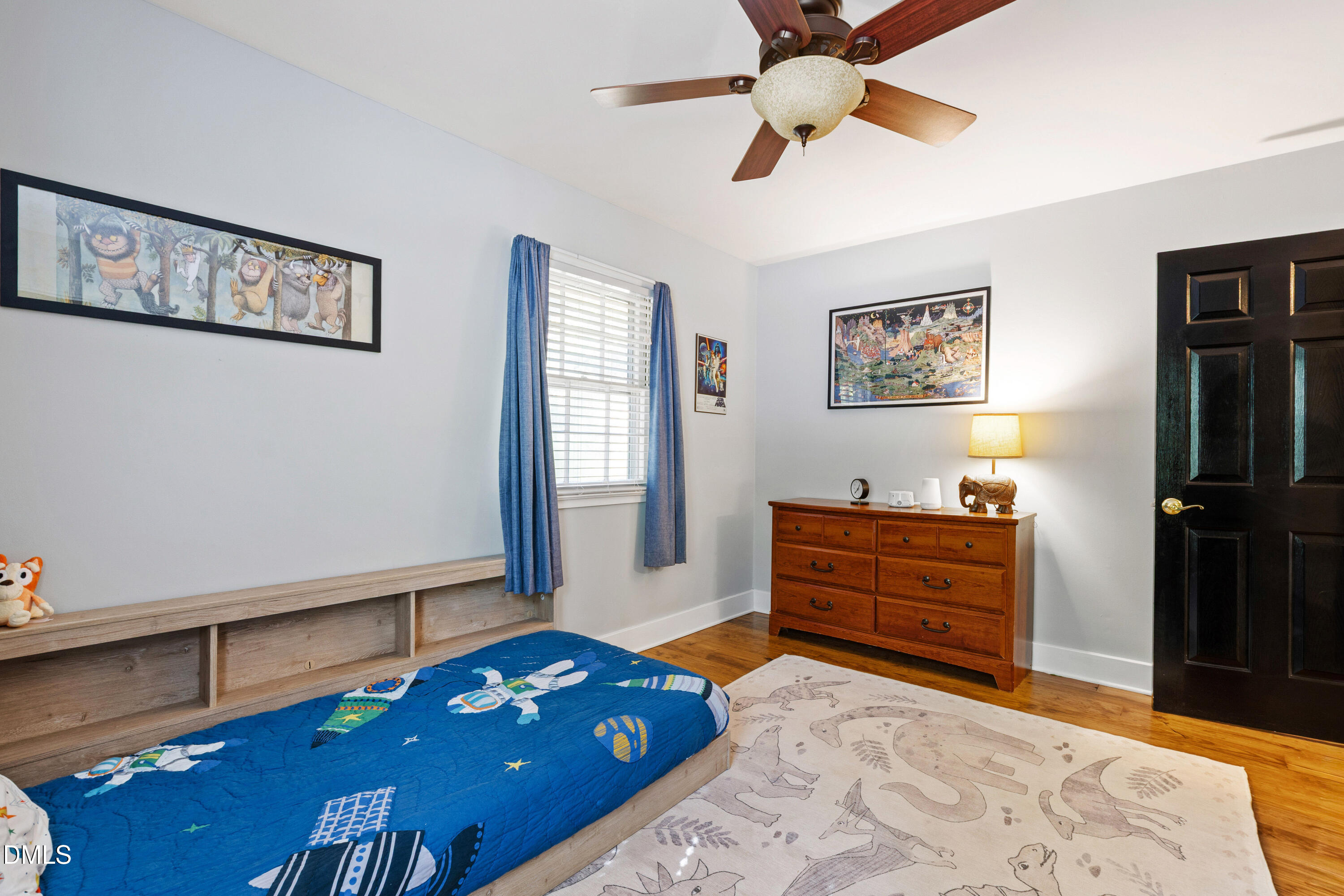 408 Troy Place Raleigh, NC 27609 - Photo 25 of 49 a bedroom with a bed window and a dresser in it