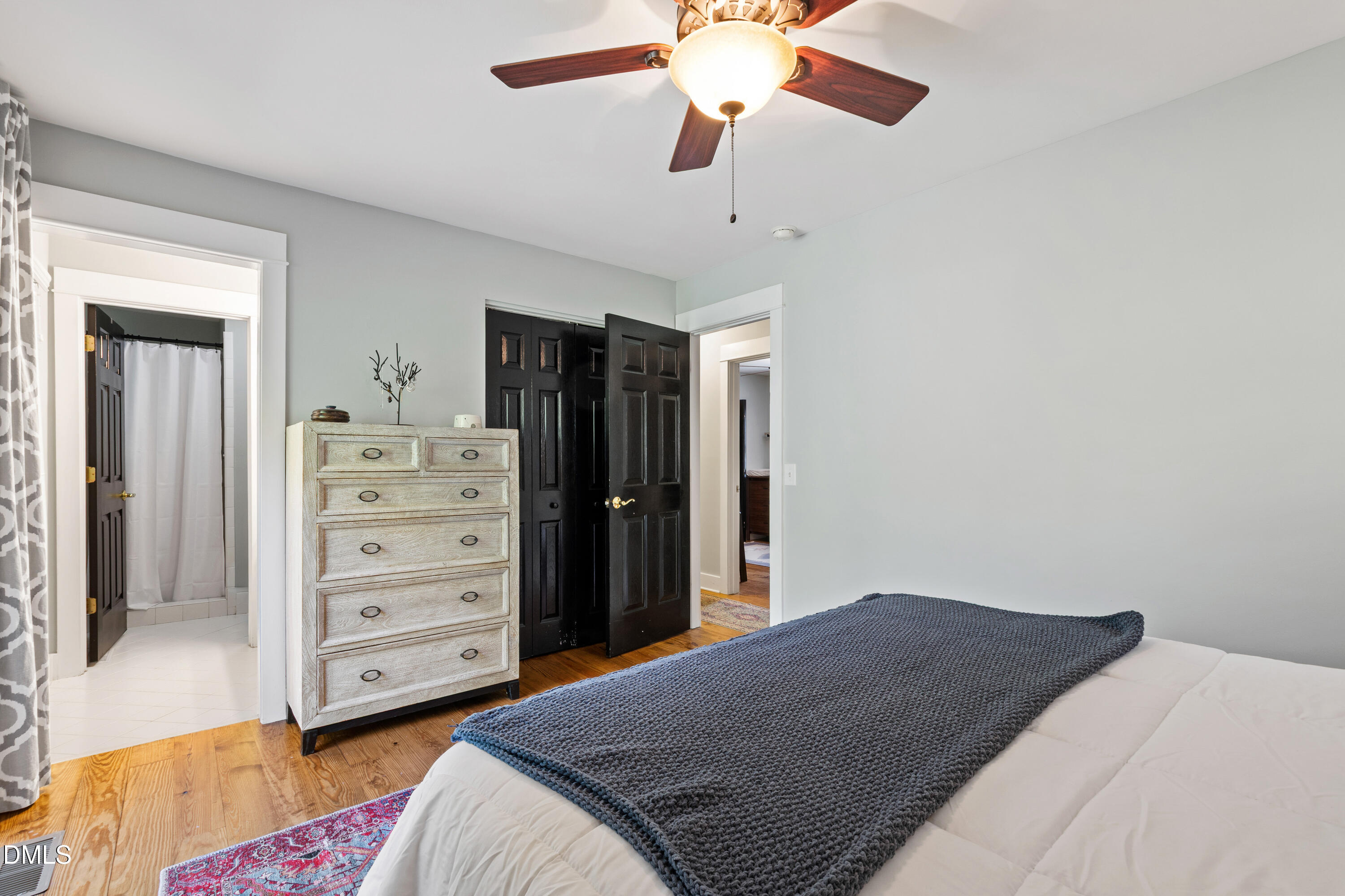 408 Troy Place Raleigh, NC 27609 - Photo 28 of 49 a bedroom with a bed and a dresser