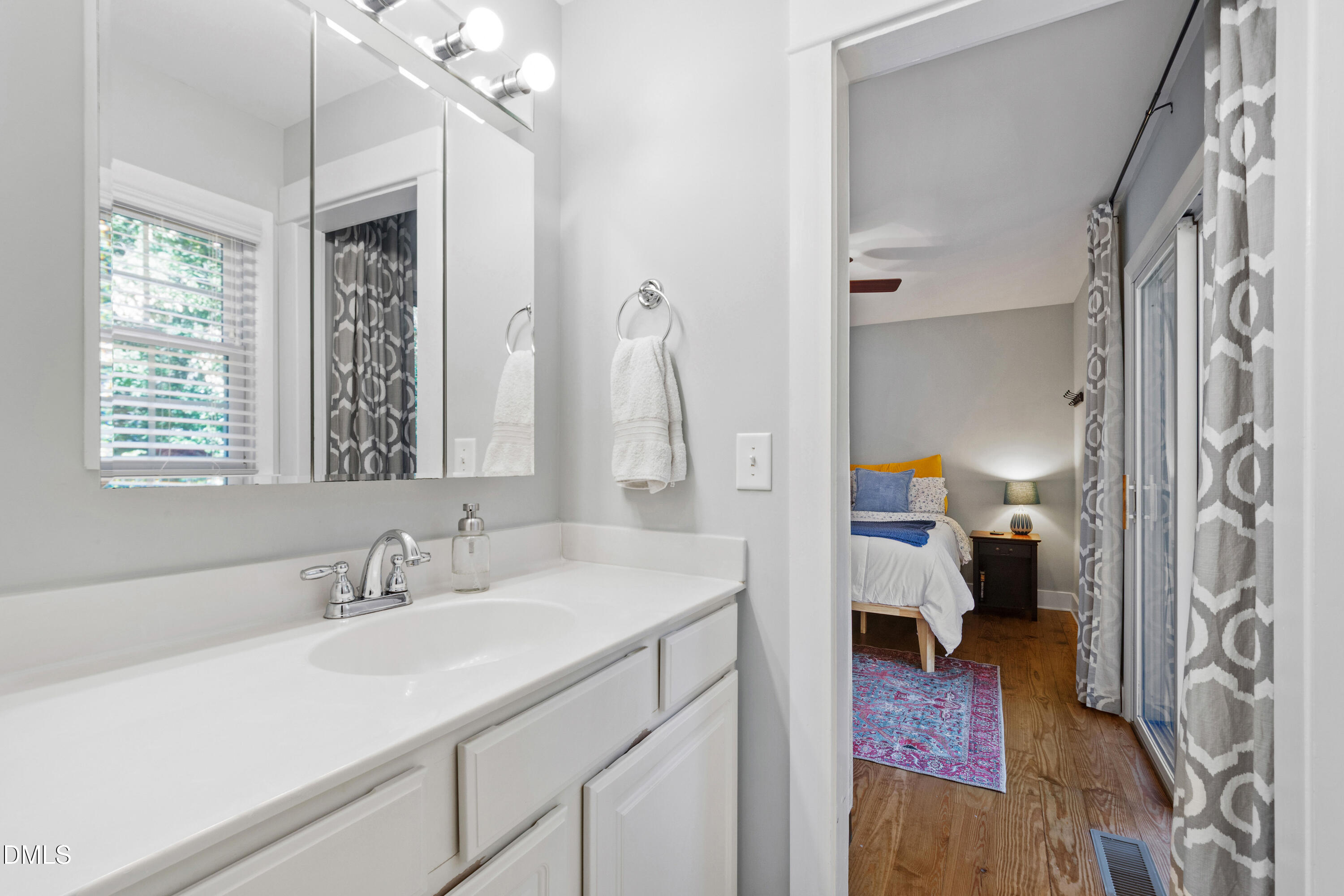 408 Troy Place Raleigh, NC 27609 - Photo 29 of 49 a en suite bathroom with a sink double vanity and a mirror