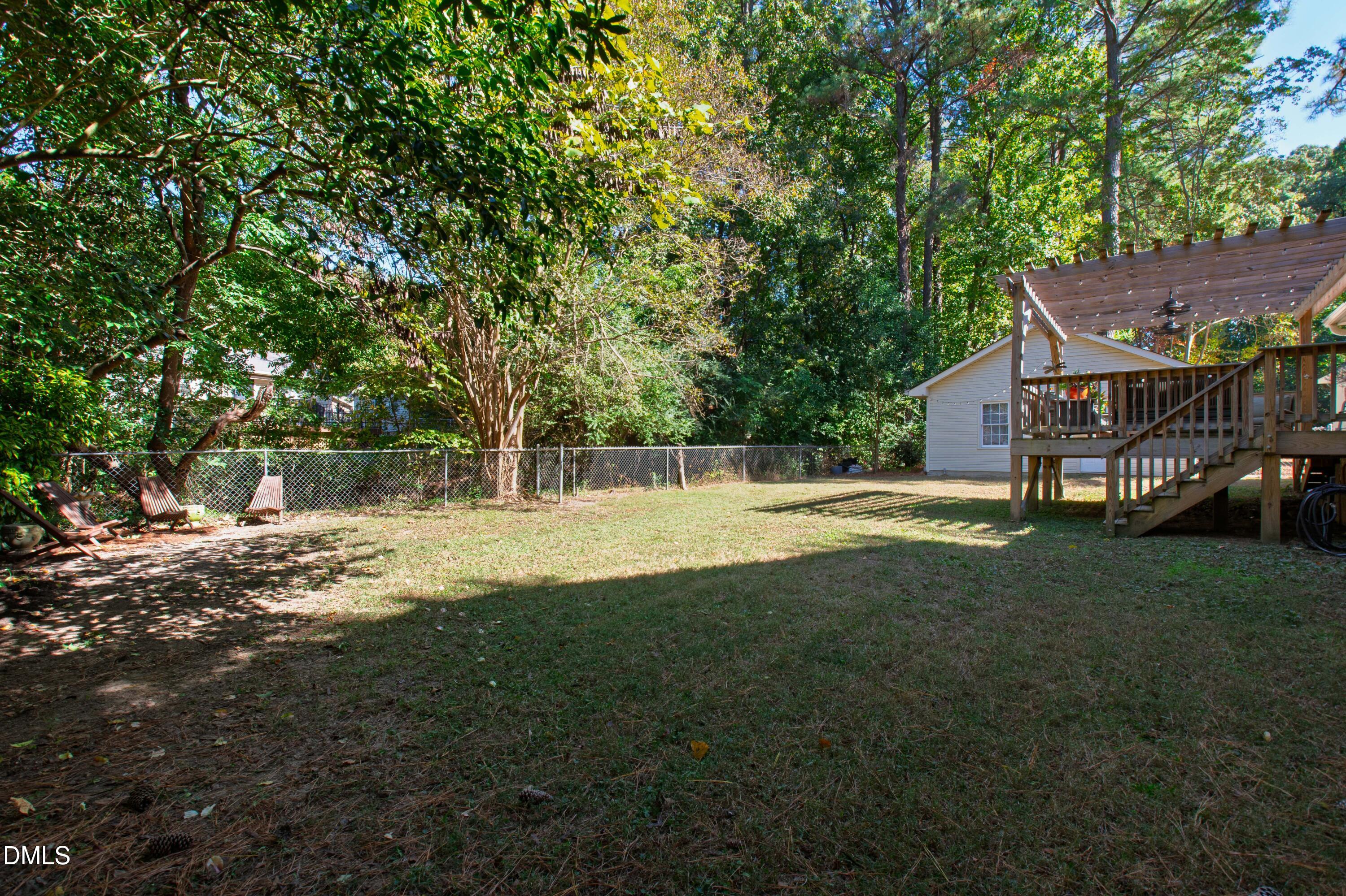 408 Troy Place Raleigh, NC 27609 - Photo 40 of 49 a view of a house with a yard
