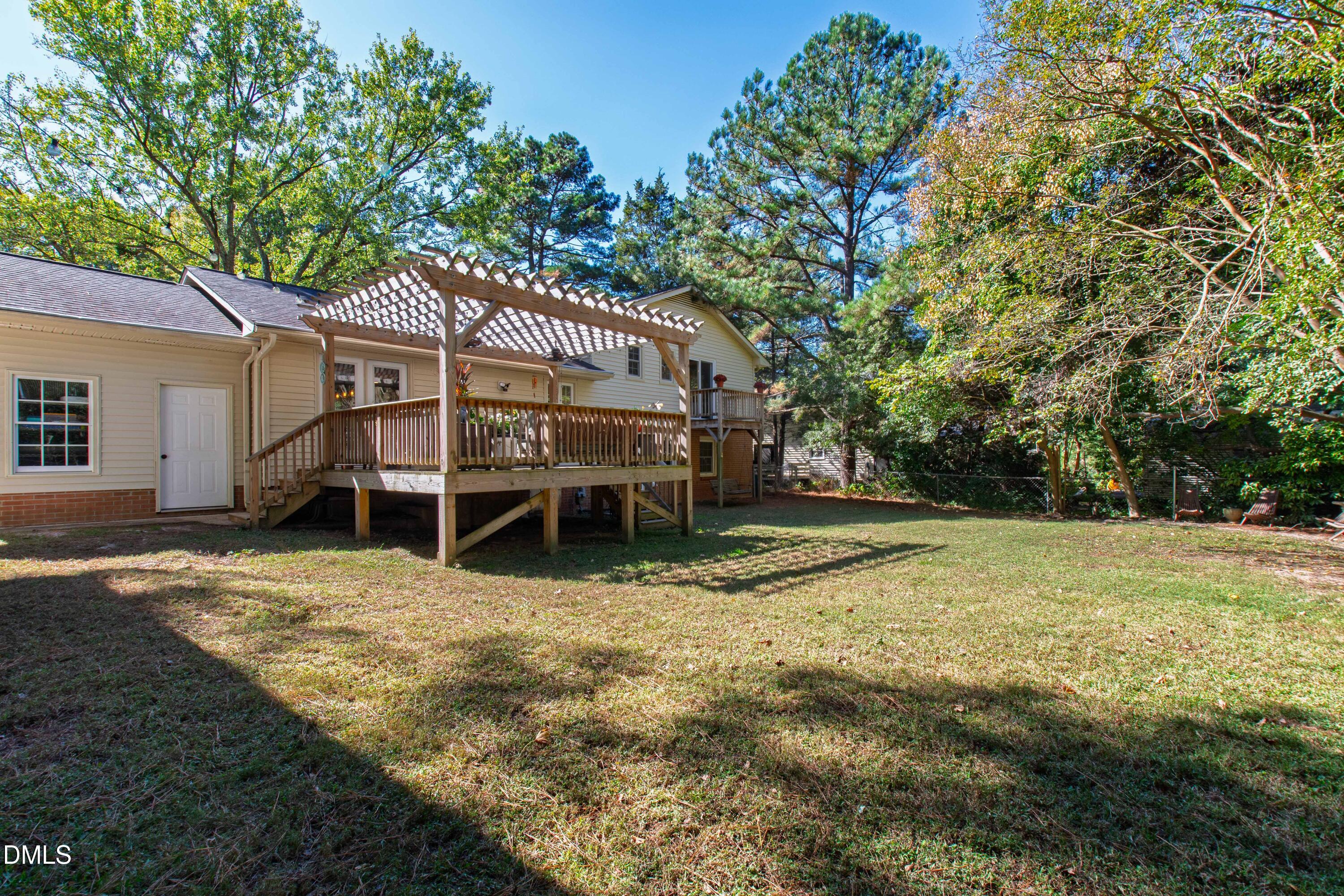 408 Troy Place Raleigh, NC 27609 - Photo 42 of 49 a house with trees in the background