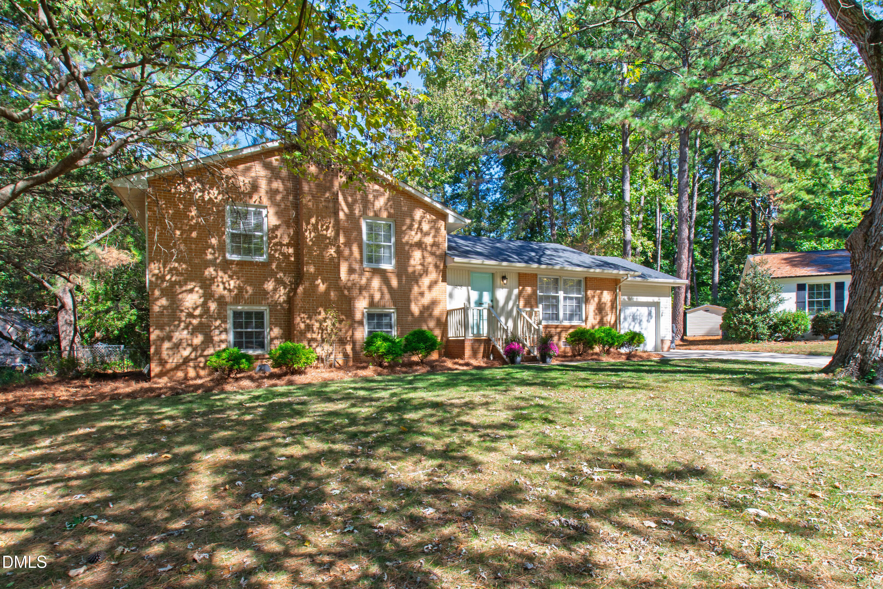 408 Troy Place Raleigh, NC 27609 - Photo 48 of 49 a backyard of a house with barbeque oven table and chairs