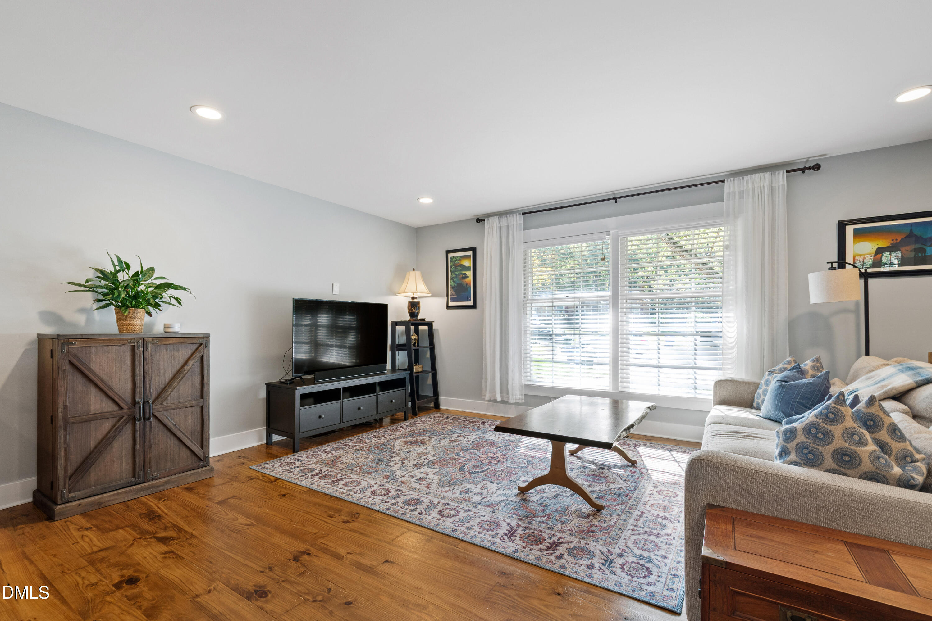 408 Troy Place Raleigh, NC 27609 - Photo 5 of 49 a living room with furniture and a flat screen tv