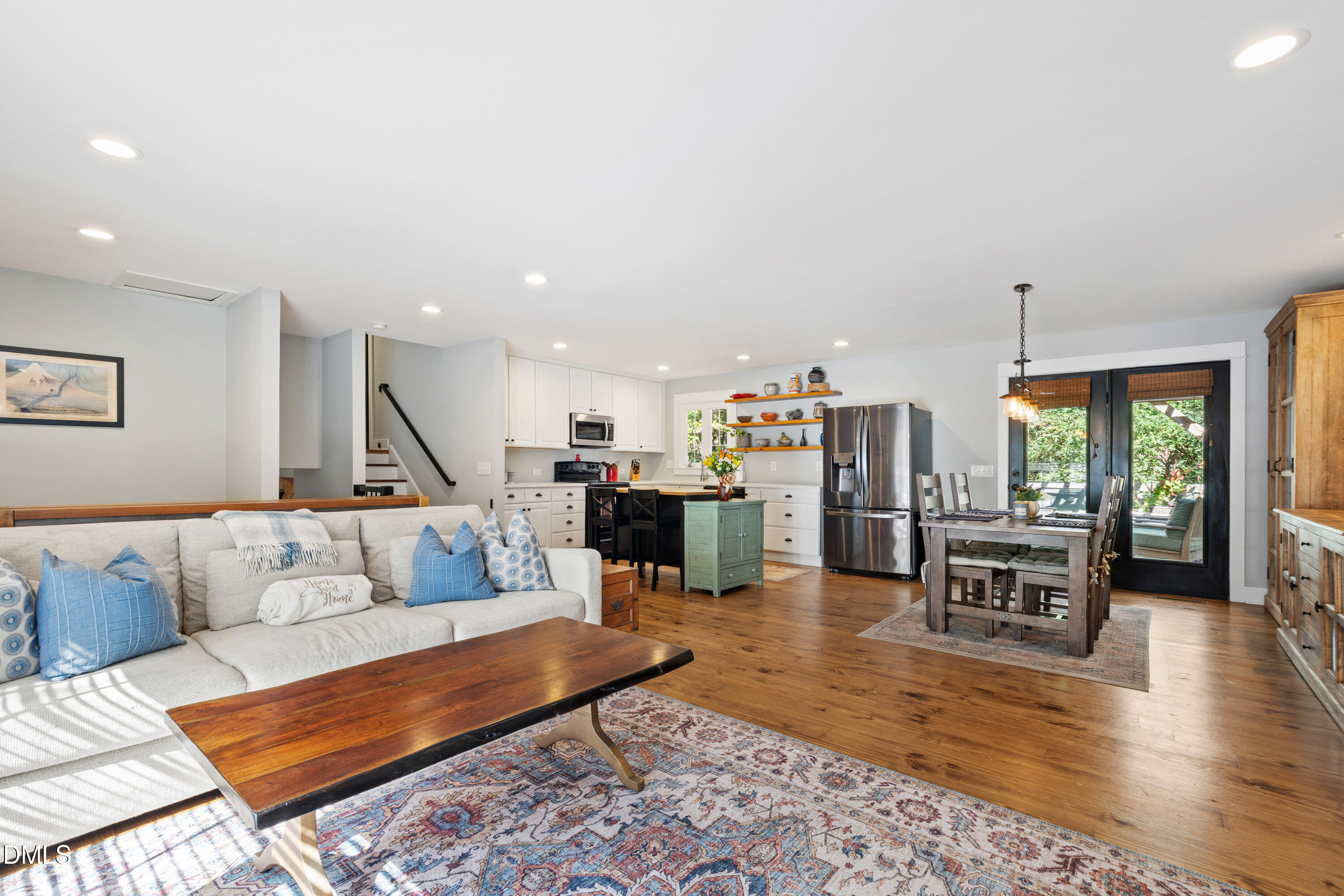 408 Troy Place Raleigh, NC 27609 - Photo 6 of 49 a living room with furniture and a large window