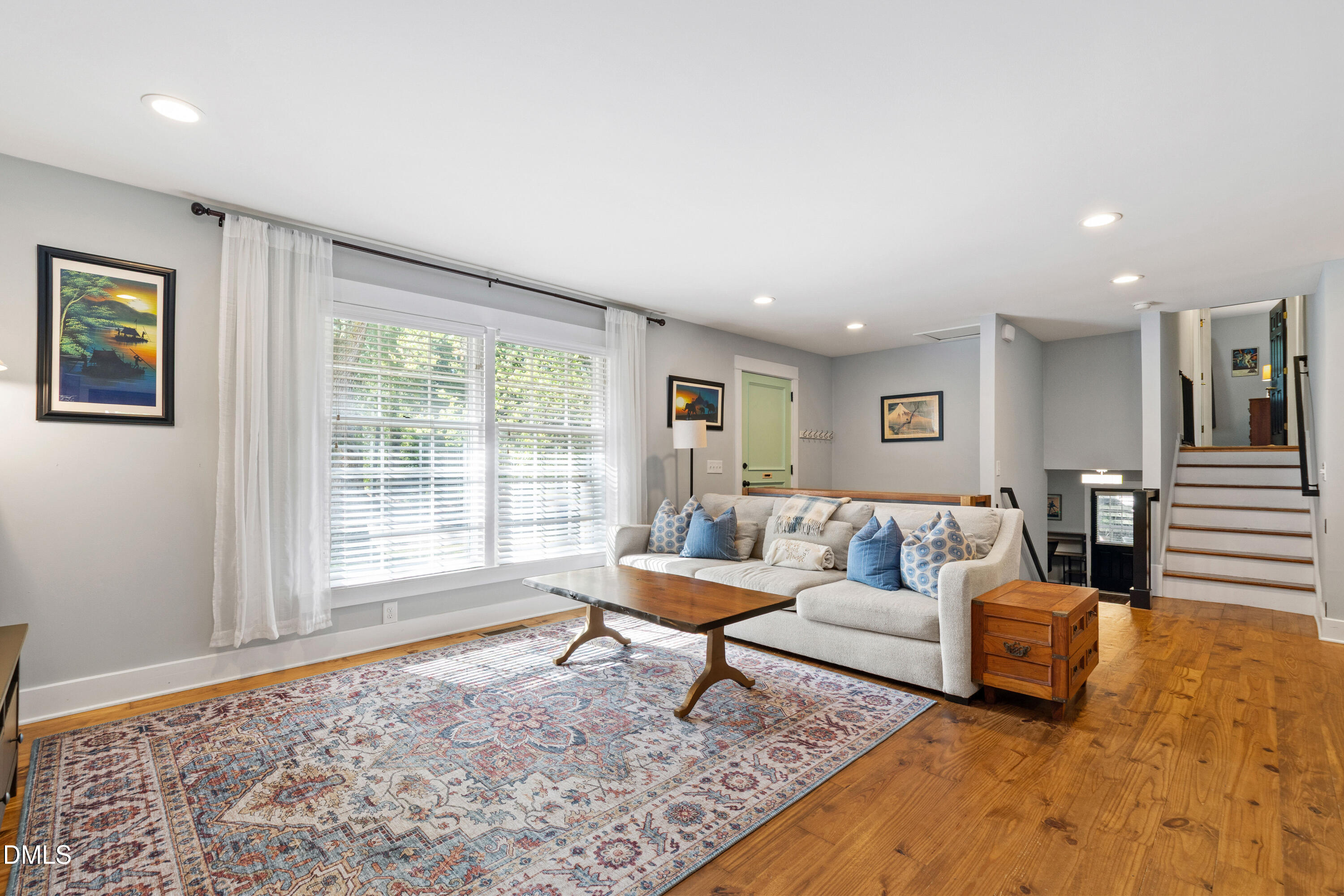 408 Troy Place Raleigh, NC 27609 - Photo 8 of 49 a living room with furniture and a rug
