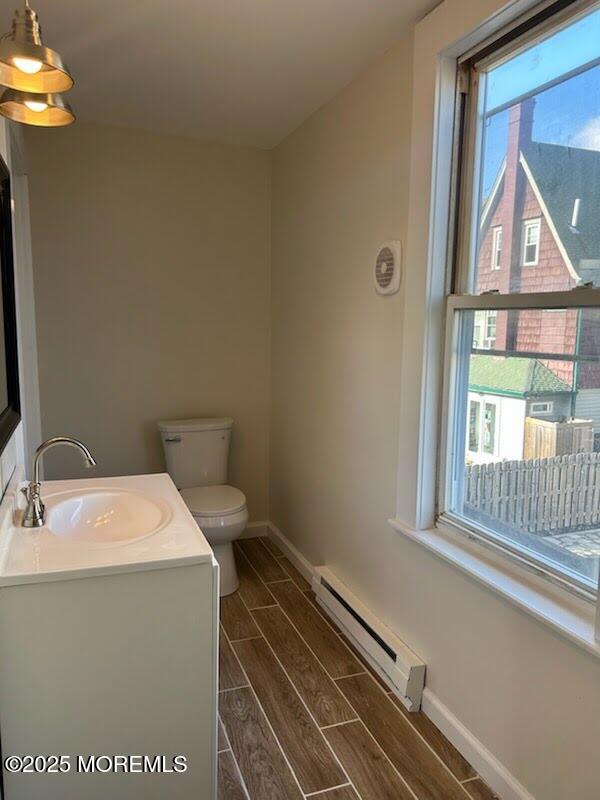 1107 Grand Avenue, Unit 4 Asbury Park, NJ 07712 - Photo 5 of 6 a bathroom with a toilet and a sink