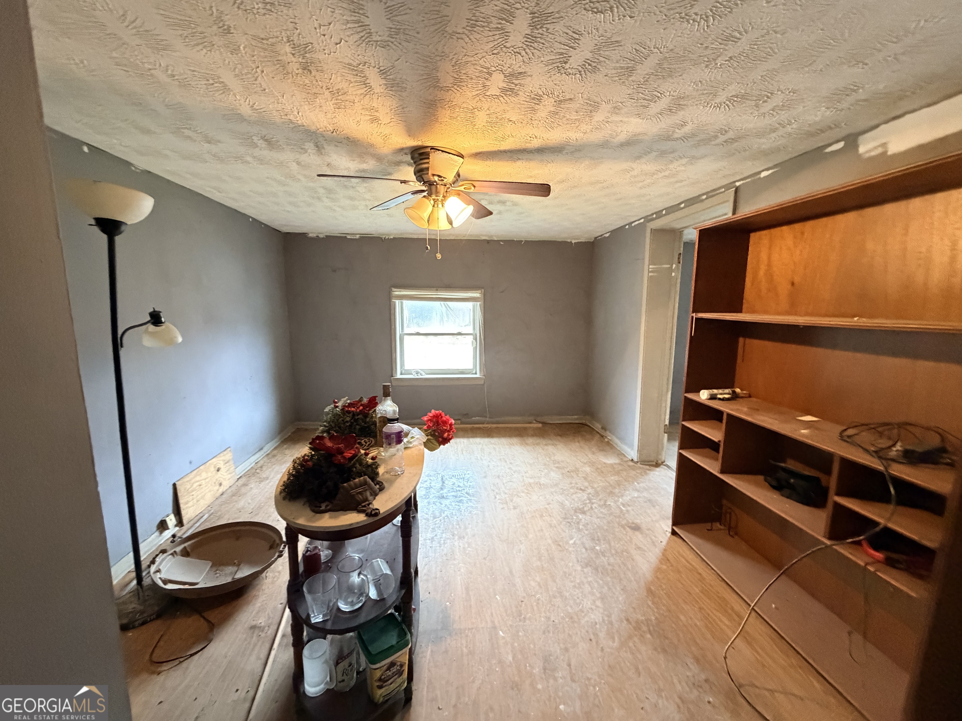 1966 Lake Rockaway Road Northwest Conyers, GA 30012 - Photo 12 of 24 a bedroom with a bed and a chandelier