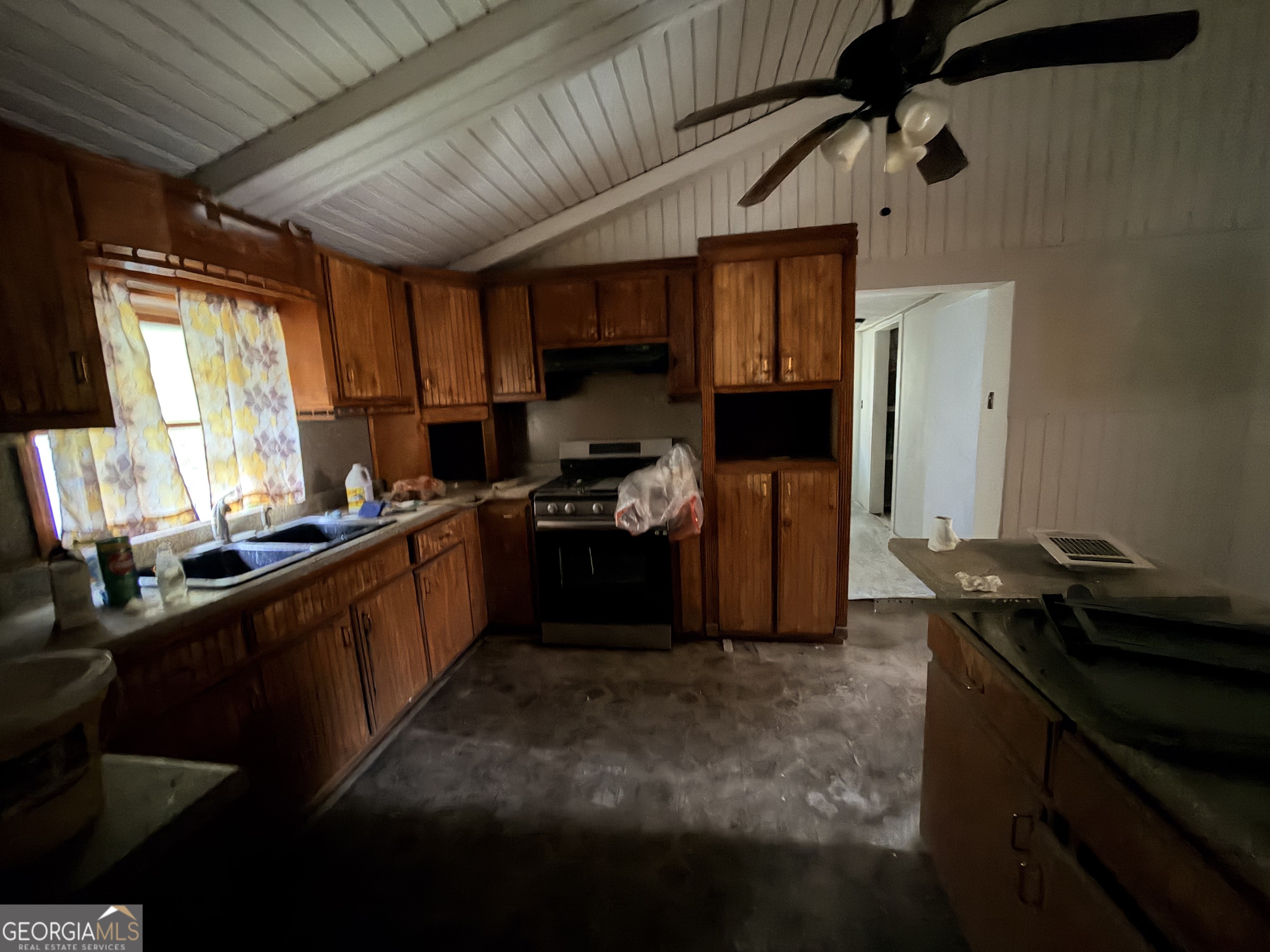 1966 Lake Rockaway Road Northwest Conyers, GA 30012 - Photo 13 of 24 a kitchen with a sink appliances cabinets and a window