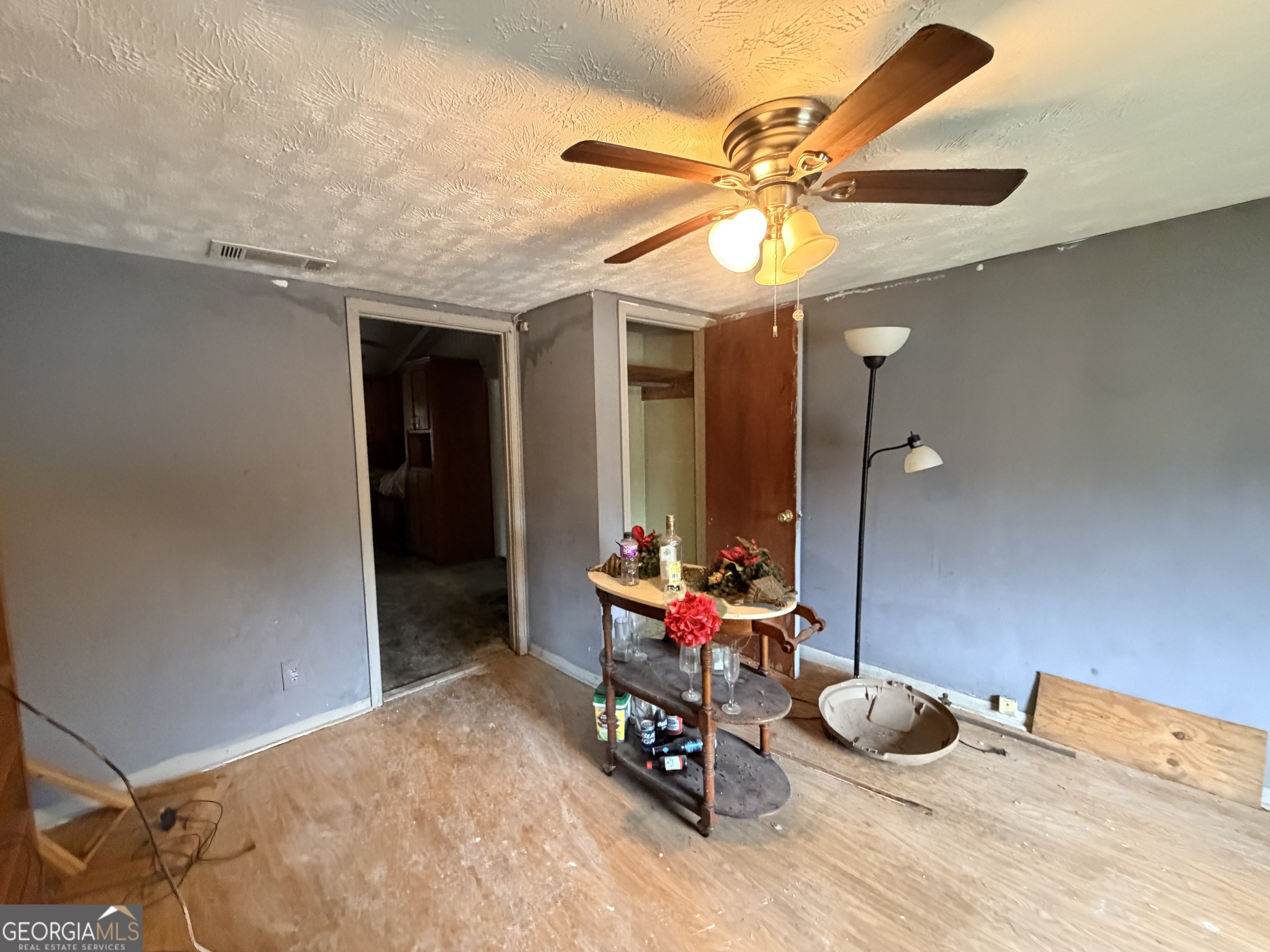 1966 Lake Rockaway Road Northwest Conyers, GA 30012 - Photo 18 of 24 a bedroom with a bed and a chandelier
