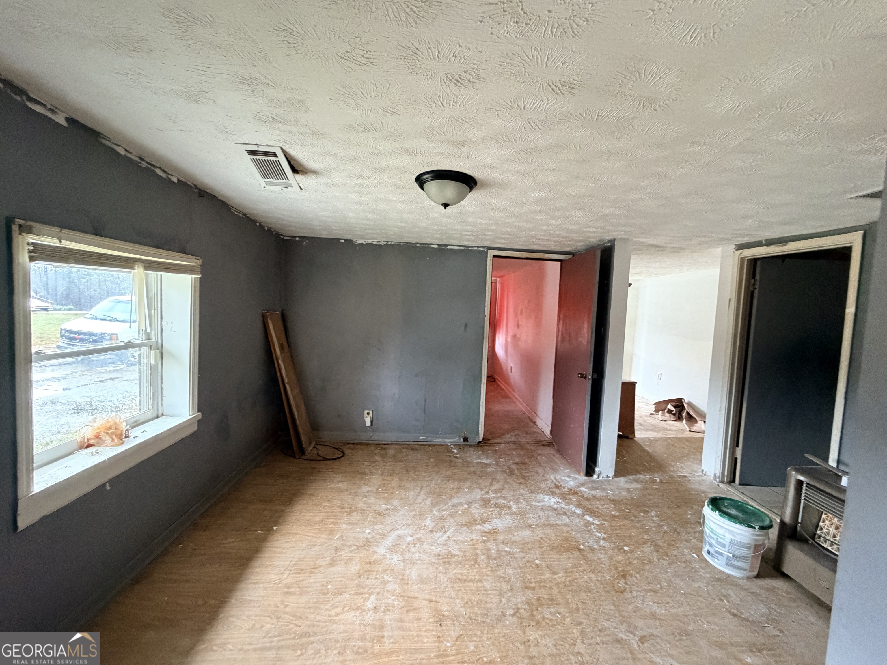 1966 Lake Rockaway Road Northwest Conyers, GA 30012 - Photo 19 of 24 a view of an empty room with a window