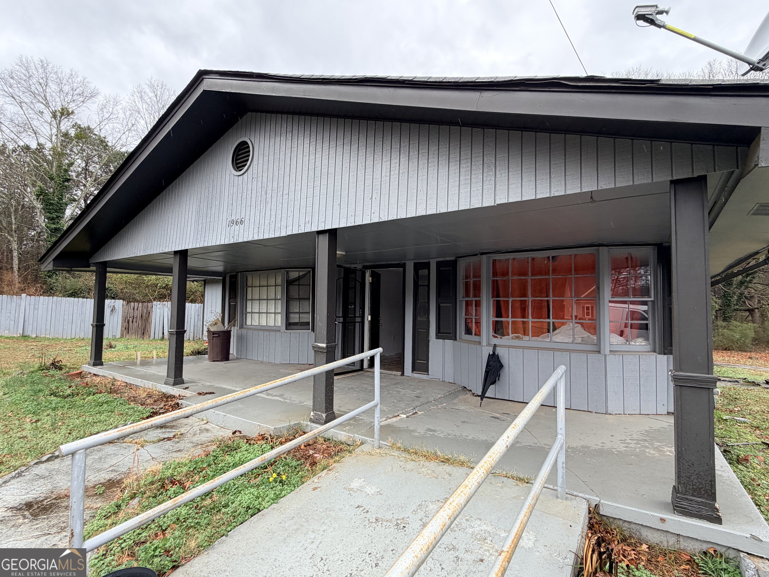 1966 Lake Rockaway Road Northwest Conyers, GA 30012 - Photo 2 of 24 a house view with a outdoor space