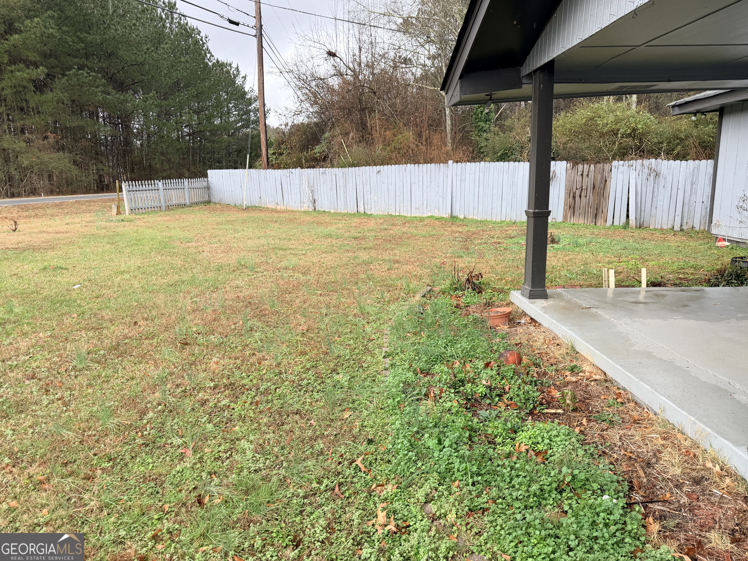1966 Lake Rockaway Road Northwest Conyers, GA 30012 - Photo 21 of 24 a view of a backyard with a small cabin