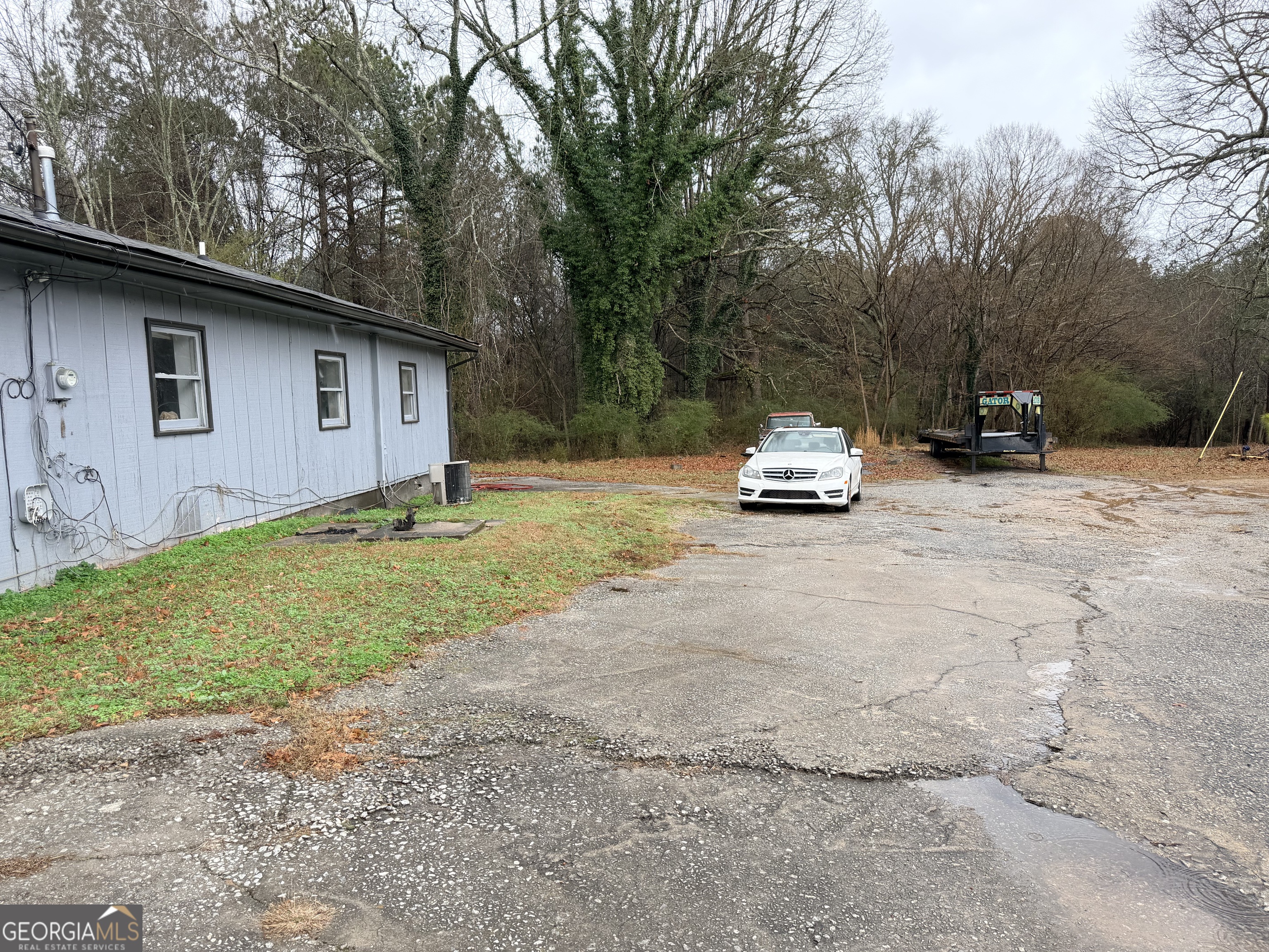 1966 Lake Rockaway Road Northwest Conyers, GA 30012 - Photo 22 of 24 a house with trees in the background