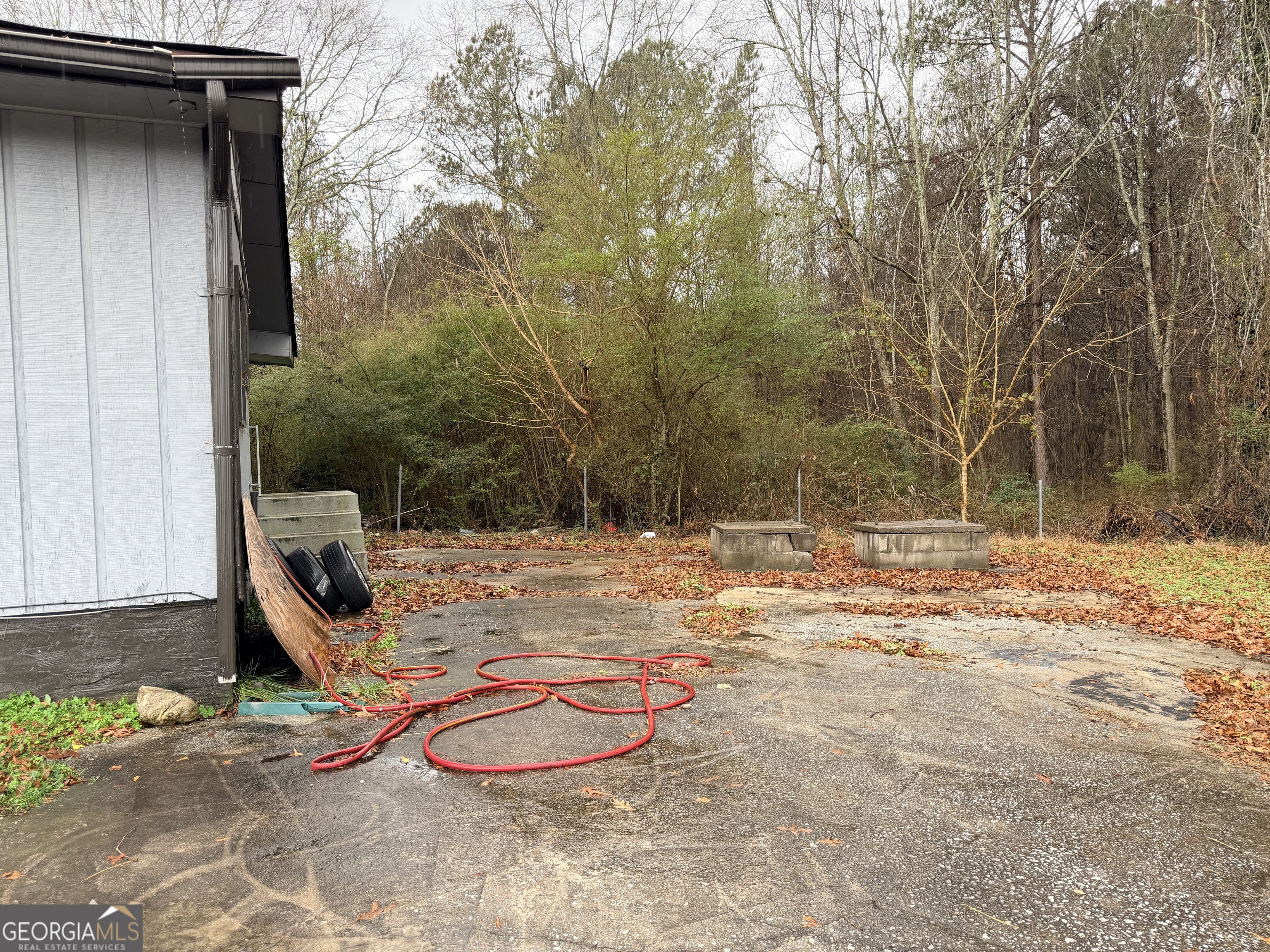 1966 Lake Rockaway Road Northwest Conyers, GA 30012 - Photo 23 of 24 a backyard of a house with barbeque oven